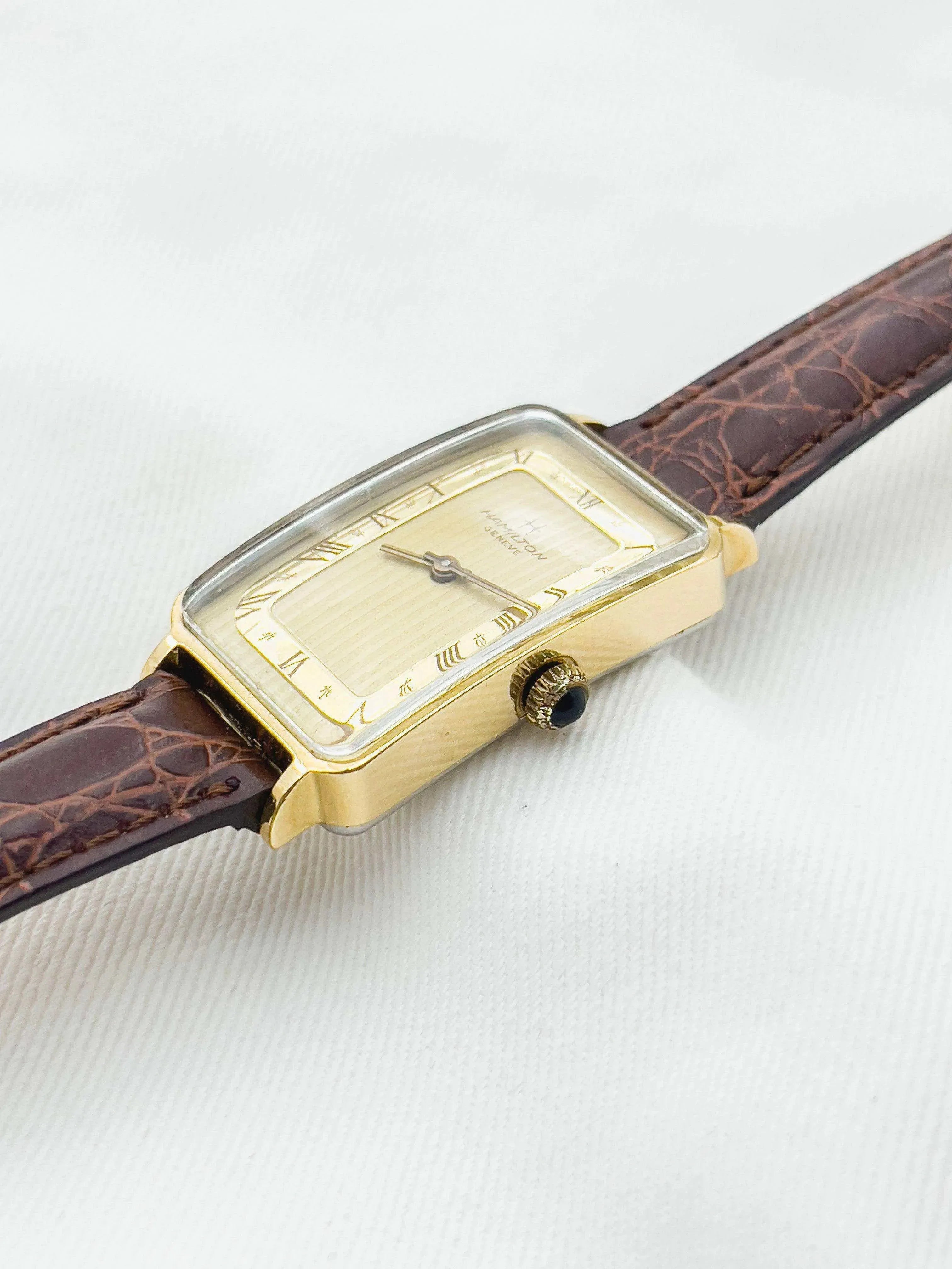Hamilton vintage watch with gold case, cream dial, Roman numerals, brown alligator strap