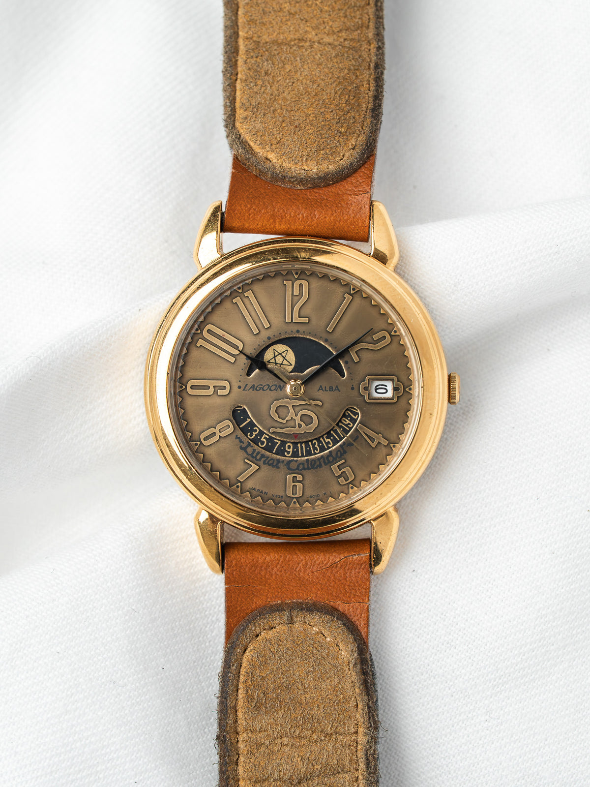 Lagoon Alba vintage watch with gold case, brown dial, lunar calendar, and leather strap