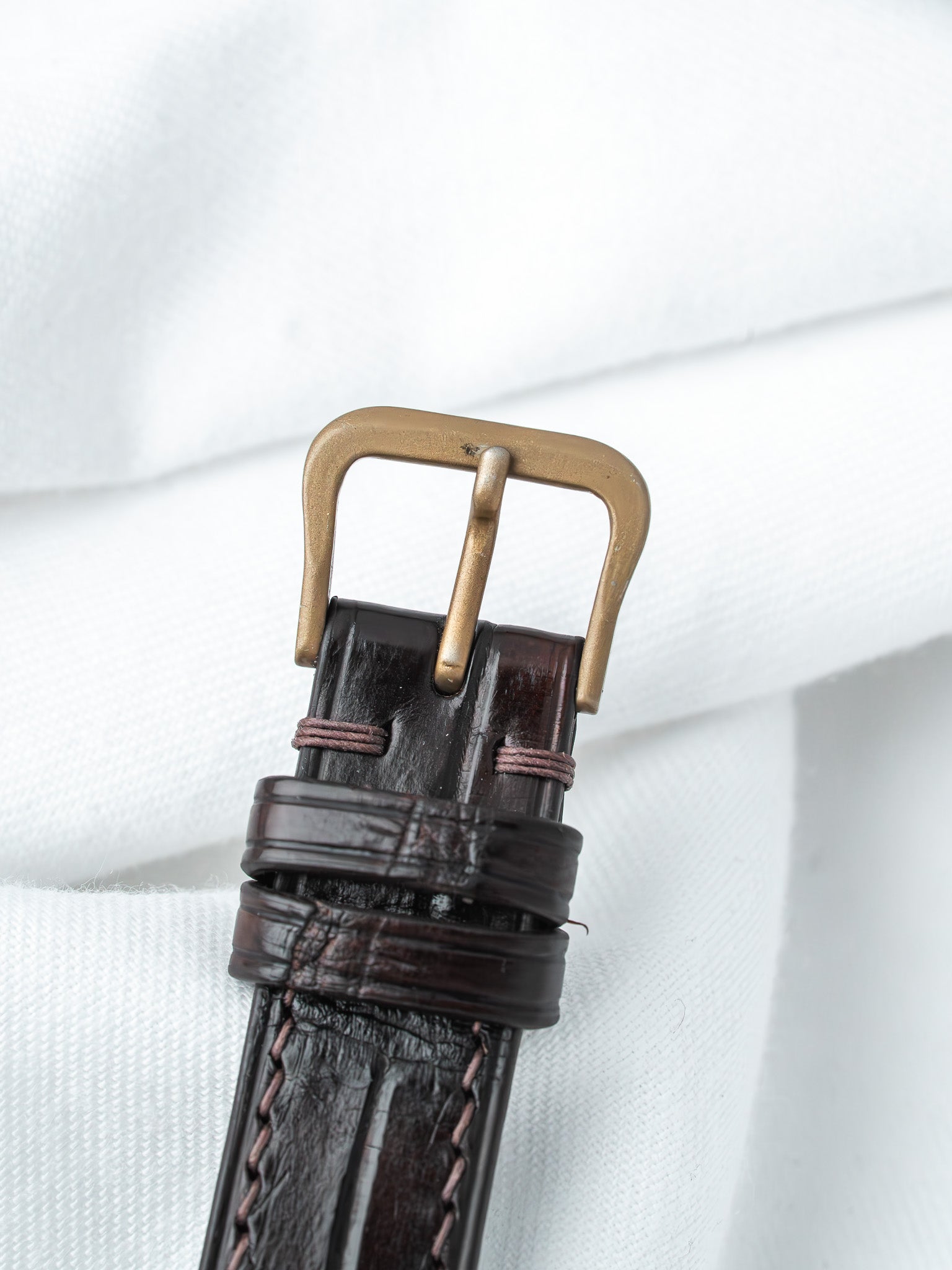 Vintage watch strap in dark brown alligator leather with bronze buckle