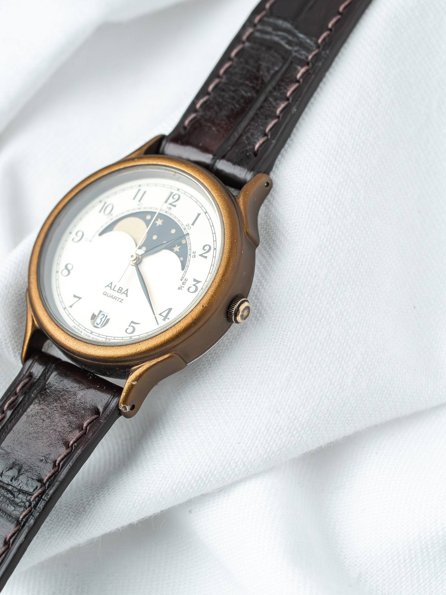 Alba Quartz vintage watch with moon phase, gold case, white dial, brown leather strap