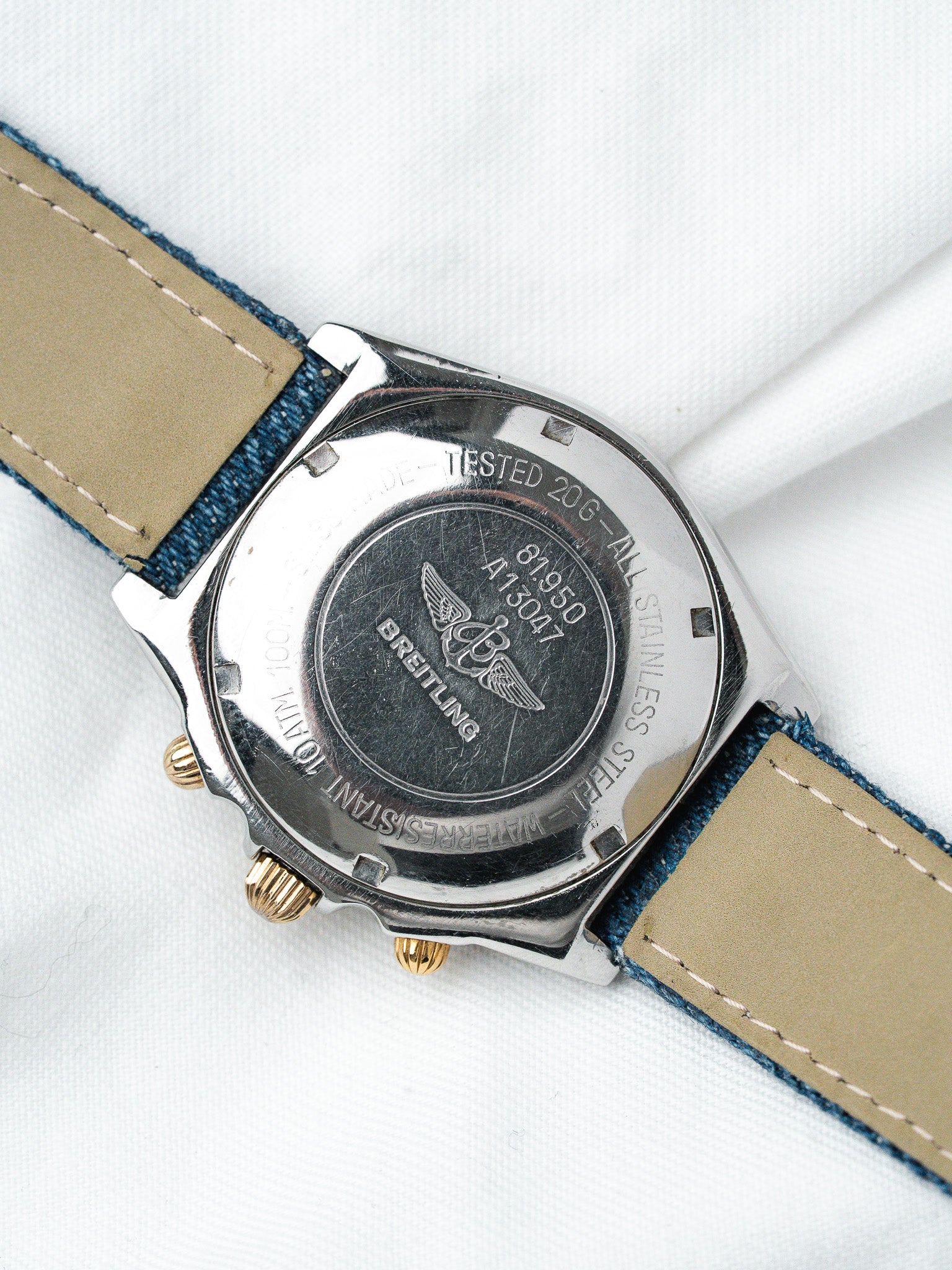 Breitling vintage watch back, stainless steel case, denim strap, gold crown