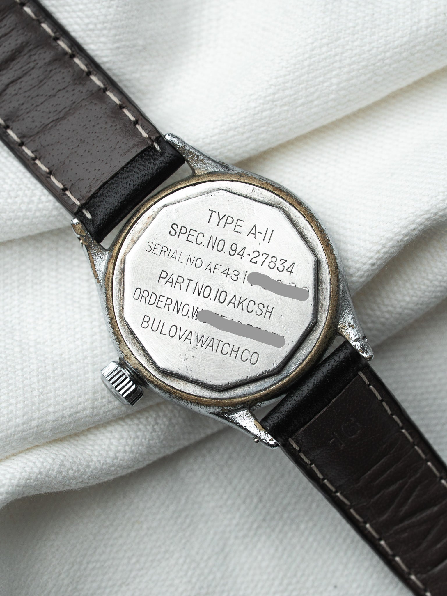 Bulova vintage watch back with Type A-II engraving, steel case, brown leather strap