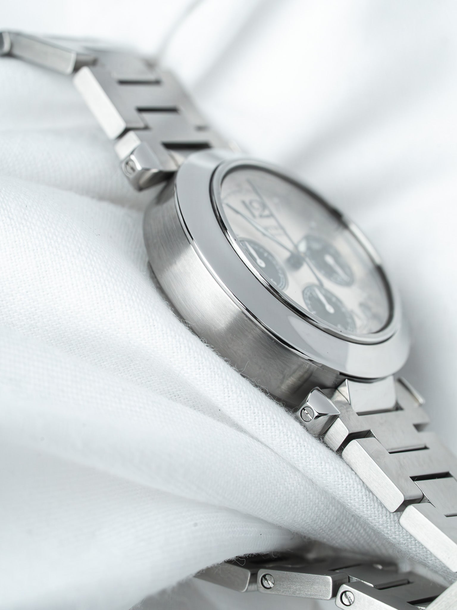 Vintage Omega chronograph watch with silver dial and steel bracelet