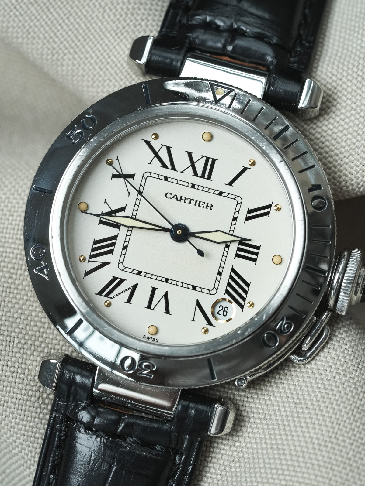 Cartier Pasha vintage watch with white dial, black bezel, and black alligator strap