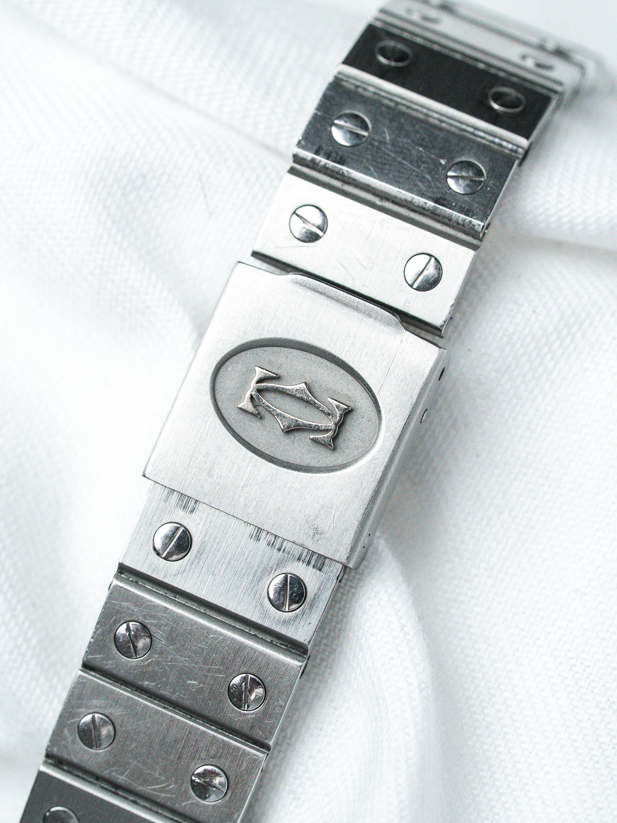 Vintage Universal Genève stainless steel bracelet with engraved logo and screw-down links