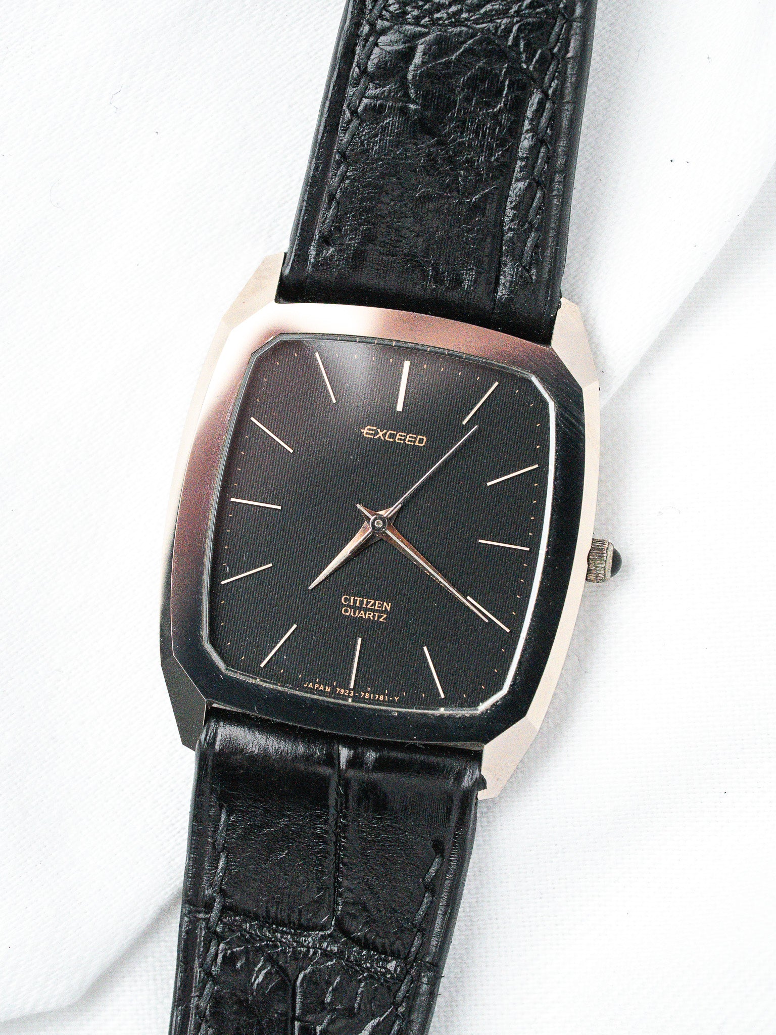 Citizen Exceed vintage watch with black dial, gold hands, and textured leather strap