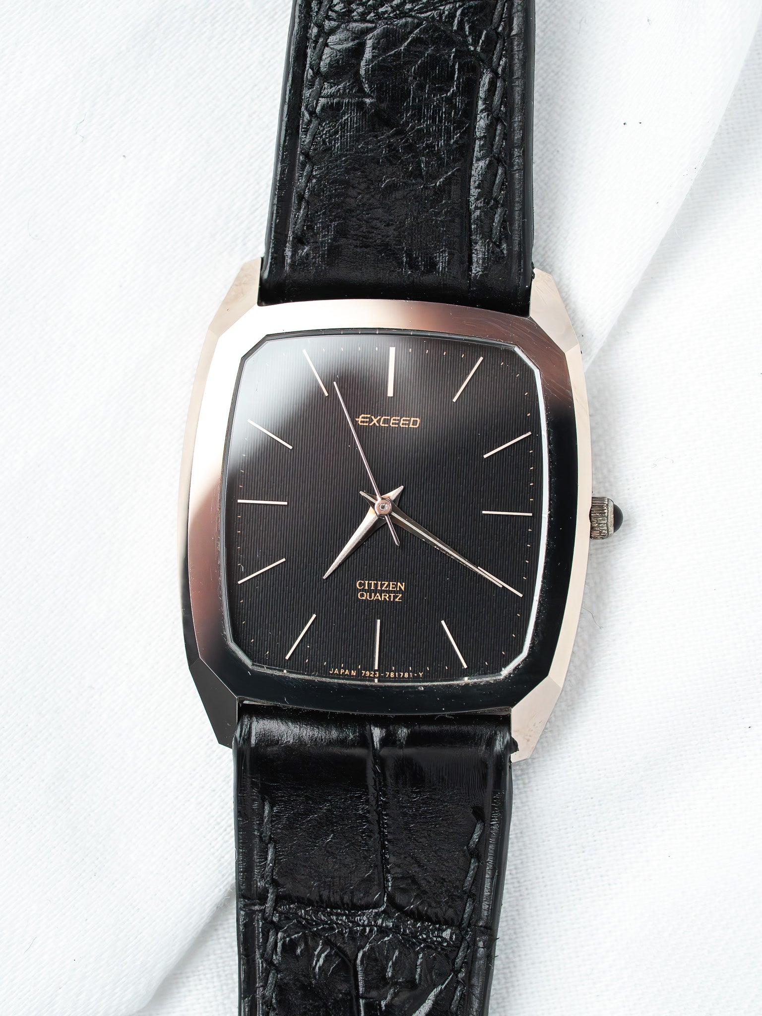Citizen Exceed vintage watch with black dial, gold accents, and textured leather strap