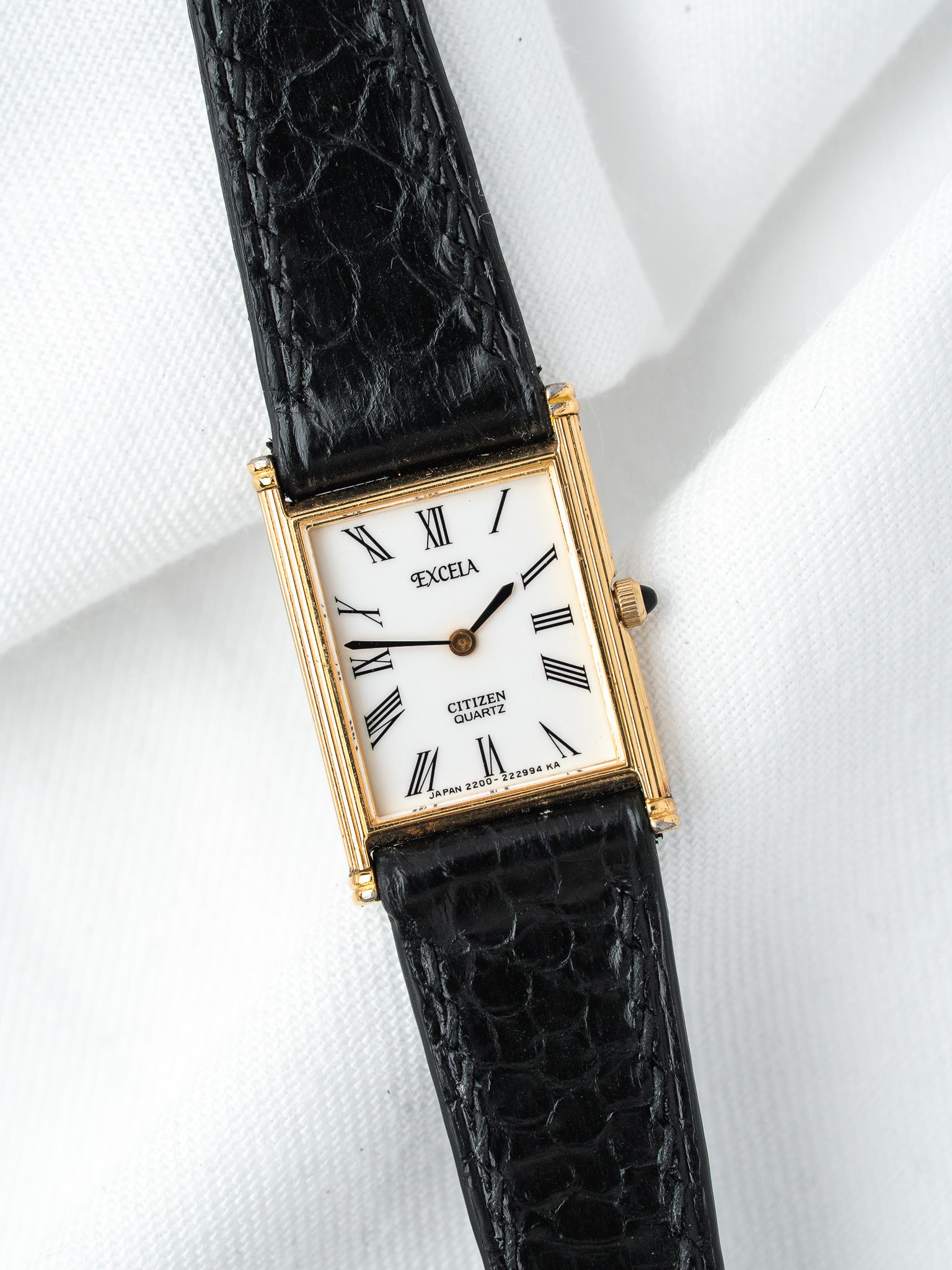 Citizen Excelsa vintage watch with gold case, white dial, Roman numerals, black alligator strap