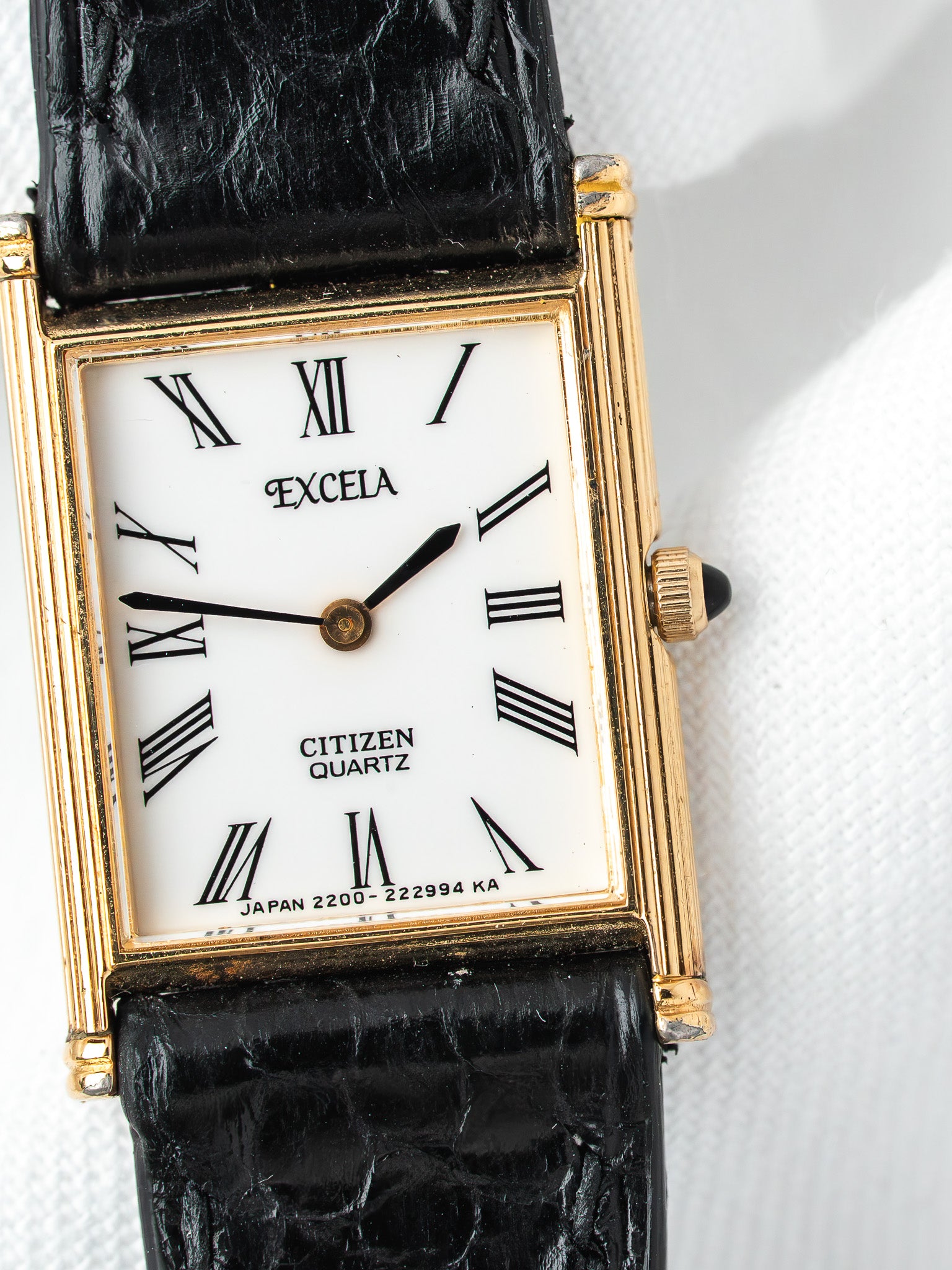 Citizen Excelsa vintage watch with gold case, white dial, Roman numerals, black leather strap