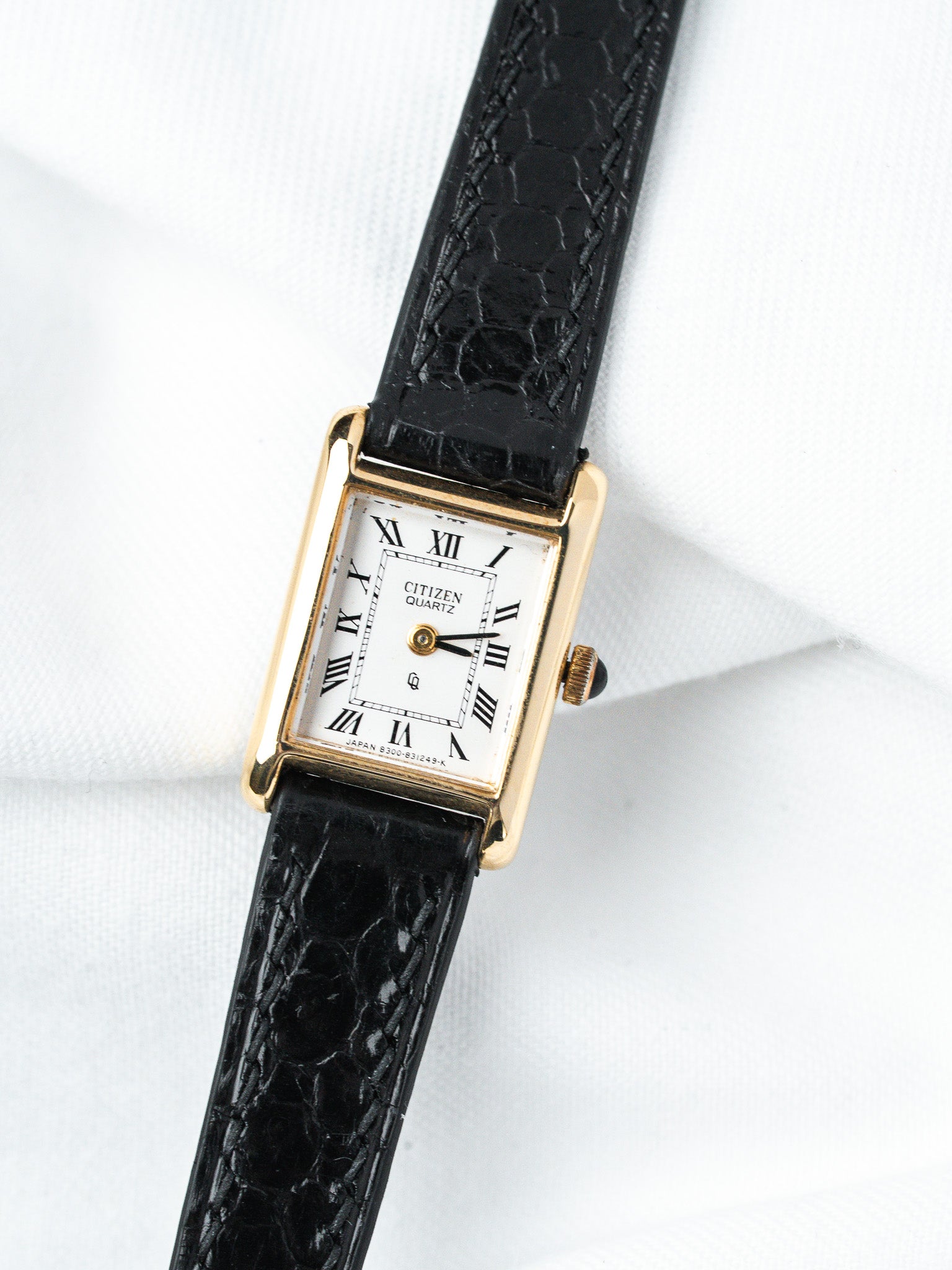Citizen Quartz vintage watch with gold case, white dial, Roman numerals, black alligator strap
