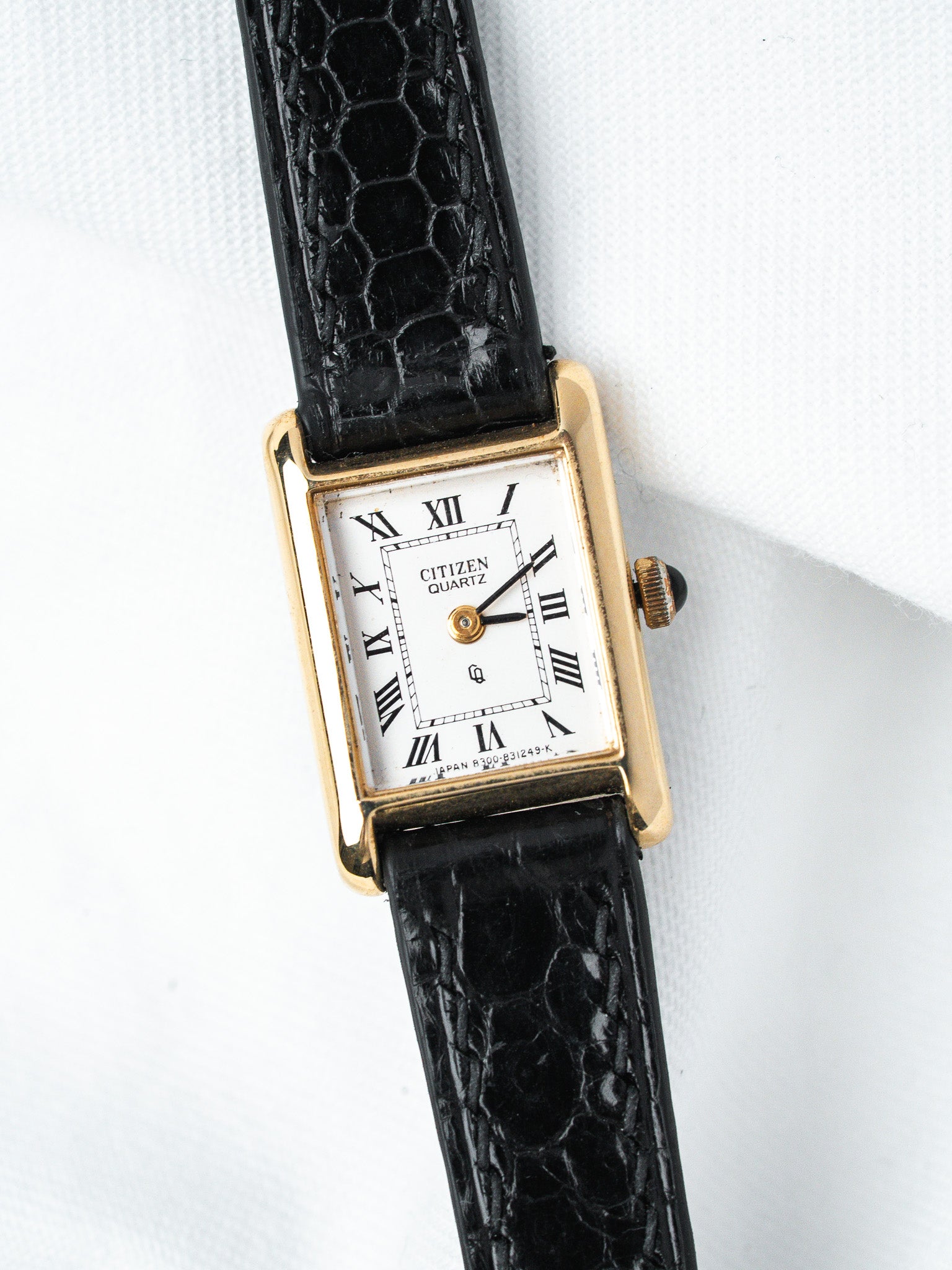 Citizen Quartz vintage watch with gold case, white dial, Roman numerals, black alligator strap