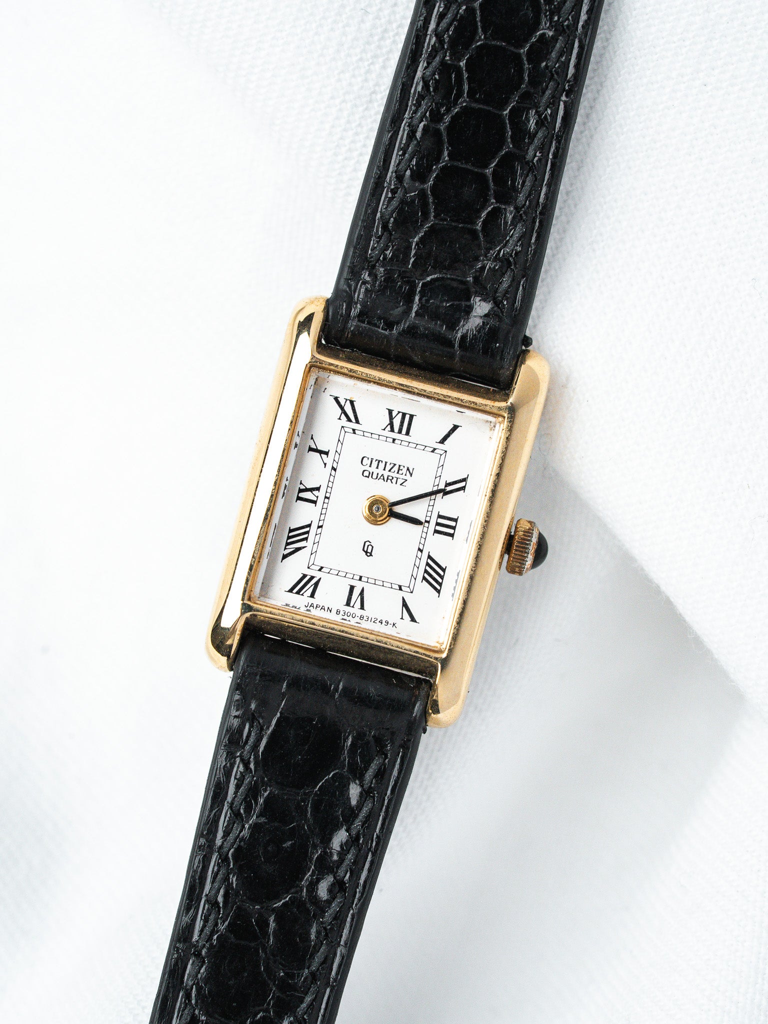 Citizen Quartz vintage watch with gold case, white dial, Roman numerals, black alligator strap