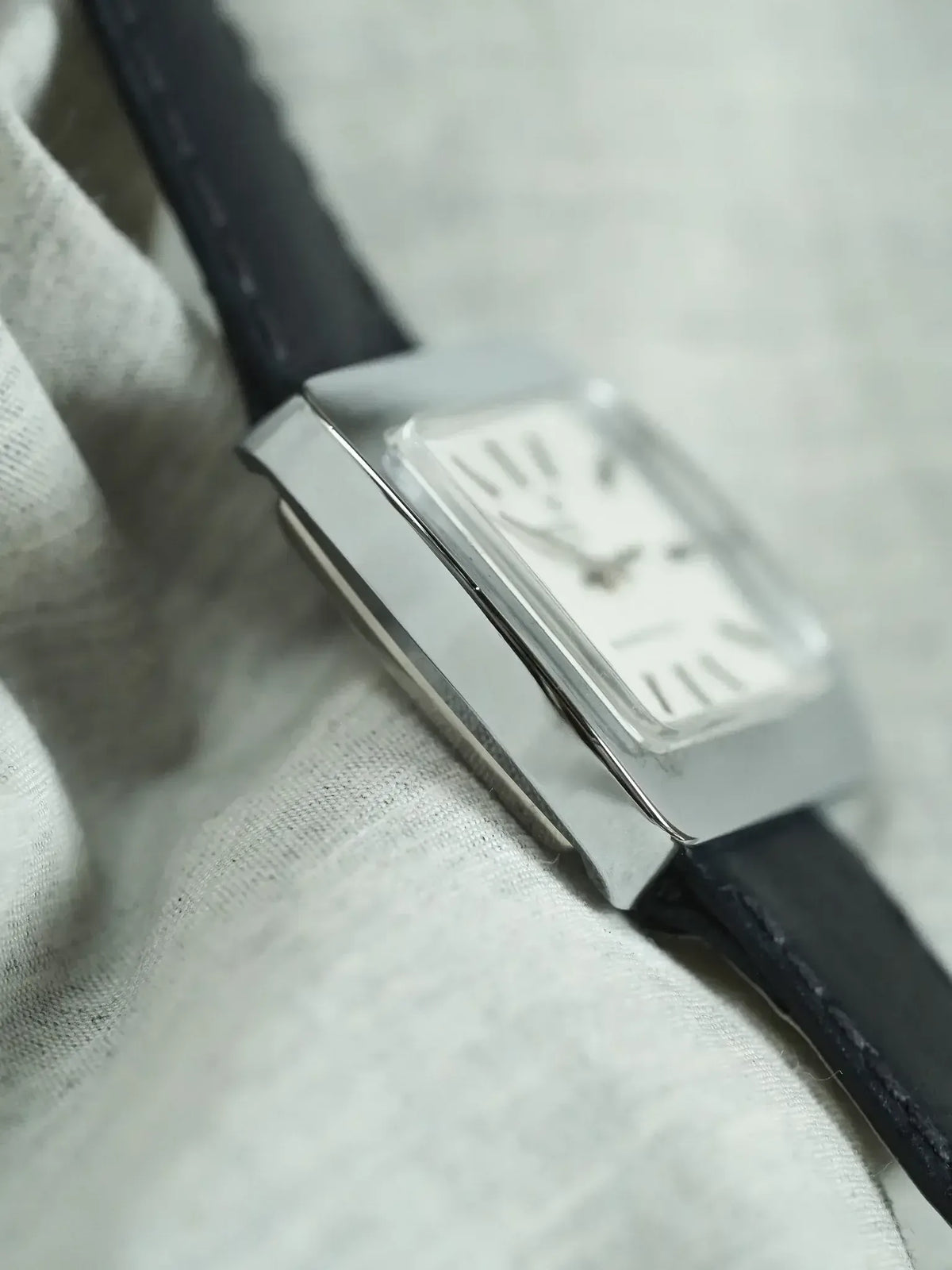Cartier Tank vintage watch with rectangular steel case and black leather strap