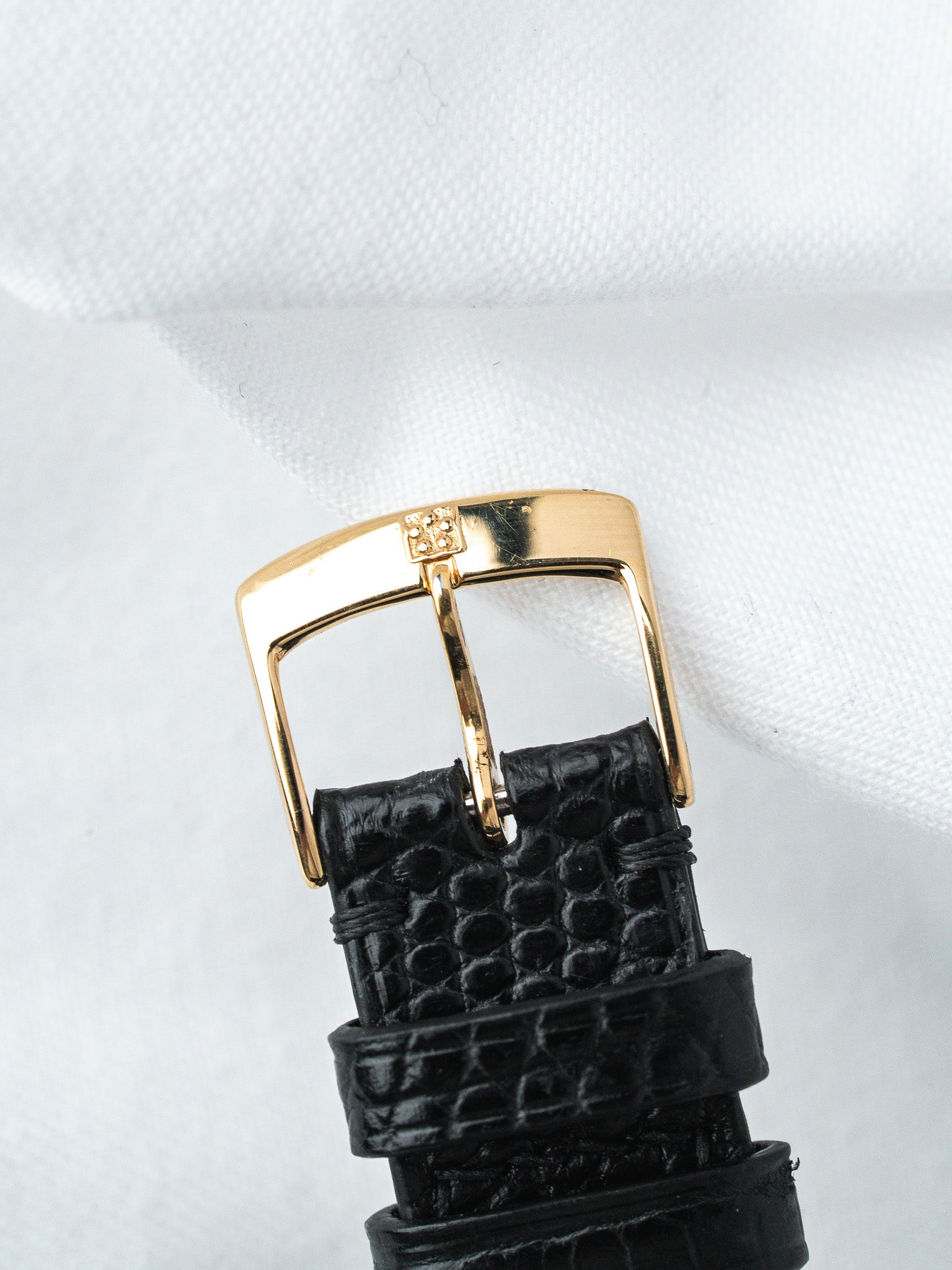 Black alligator strap with gold buckle, vintage luxury watch accessory