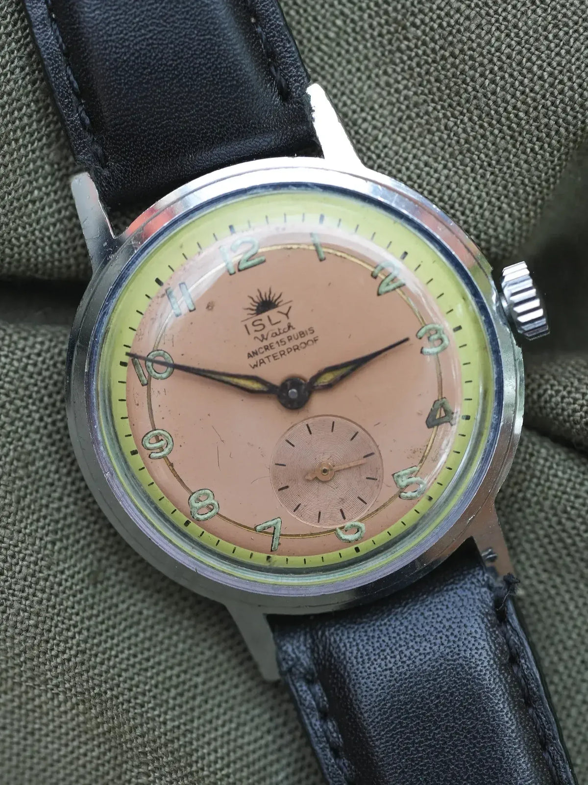 Vintage ISLY Watch with salmon dial, black leather strap, and steel case