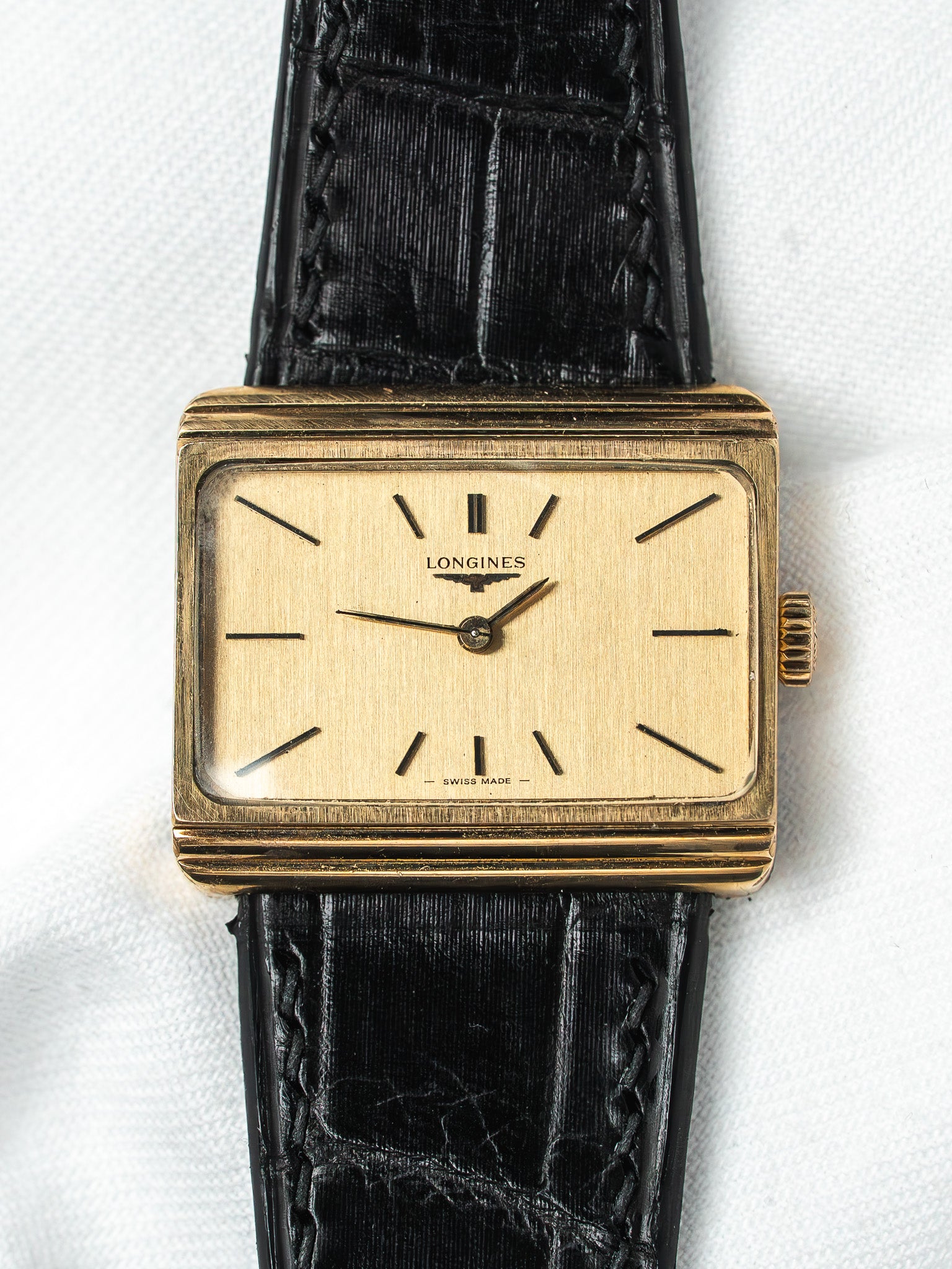 Longines vintage watch with gold case, cream dial, black alligator strap