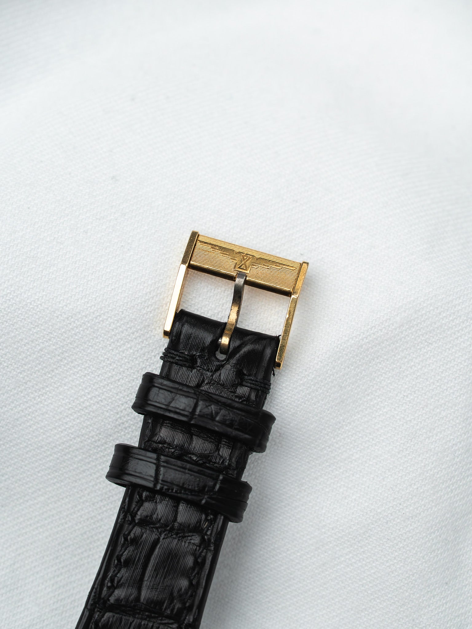 Black alligator strap with gold buckle, vintage luxury watch accessory
