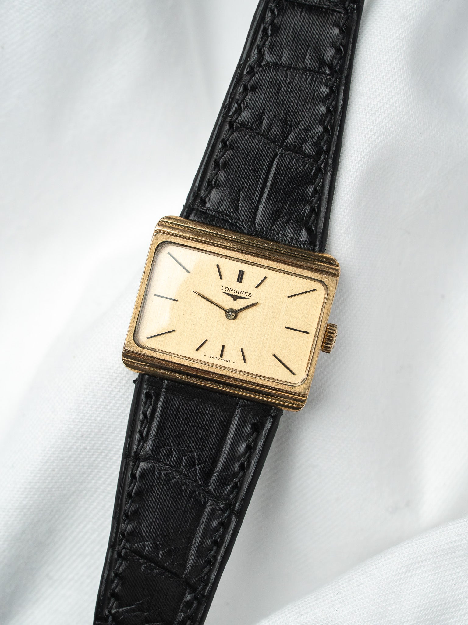 Vintage Longines rectangular gold watch with cream dial and black alligator strap