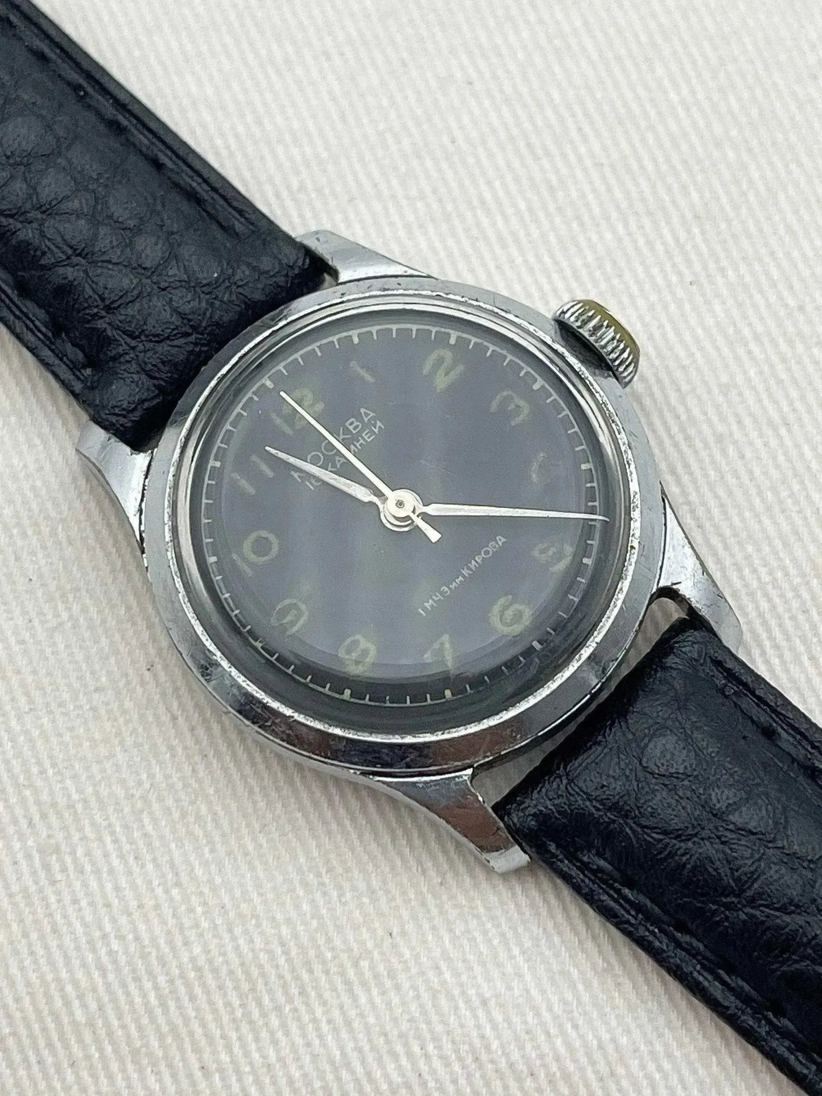 Vintage Poljot Moscow watch with grey dial, steel case, and black leather strap