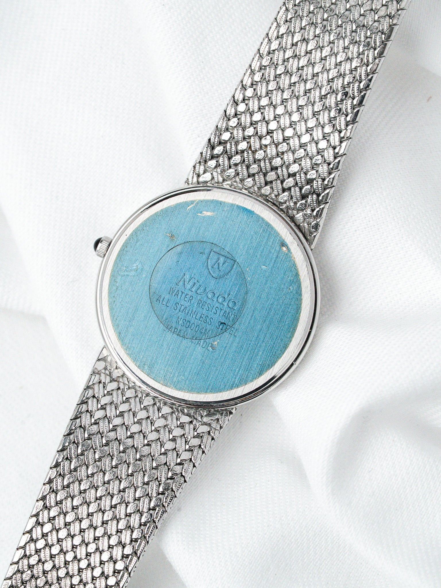 Nivada vintage watch with blue case back and stainless steel mesh bracelet