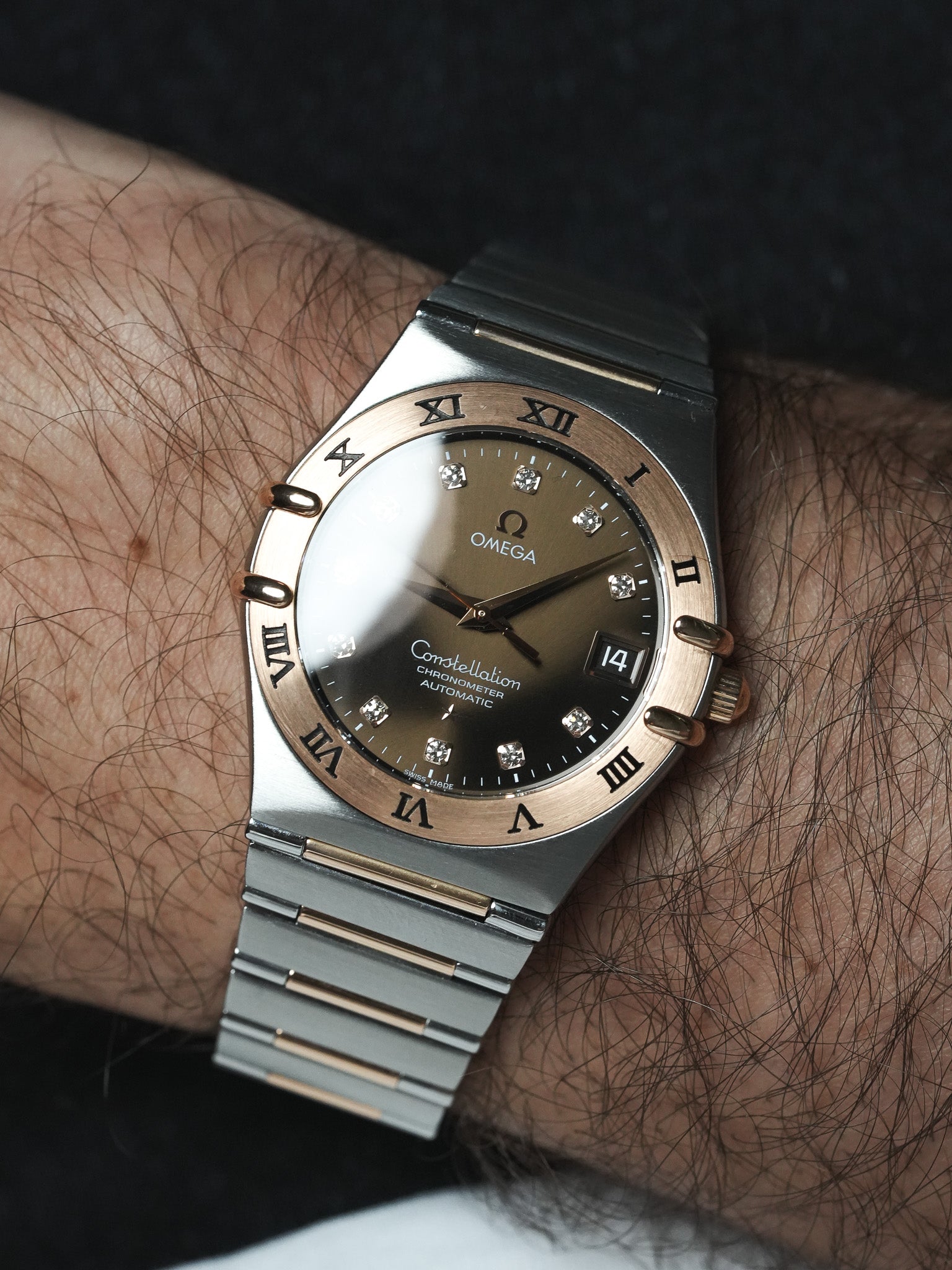 Omega Constellation vintage watch with diamond hour markers, two-tone bracelet, worn on wrist