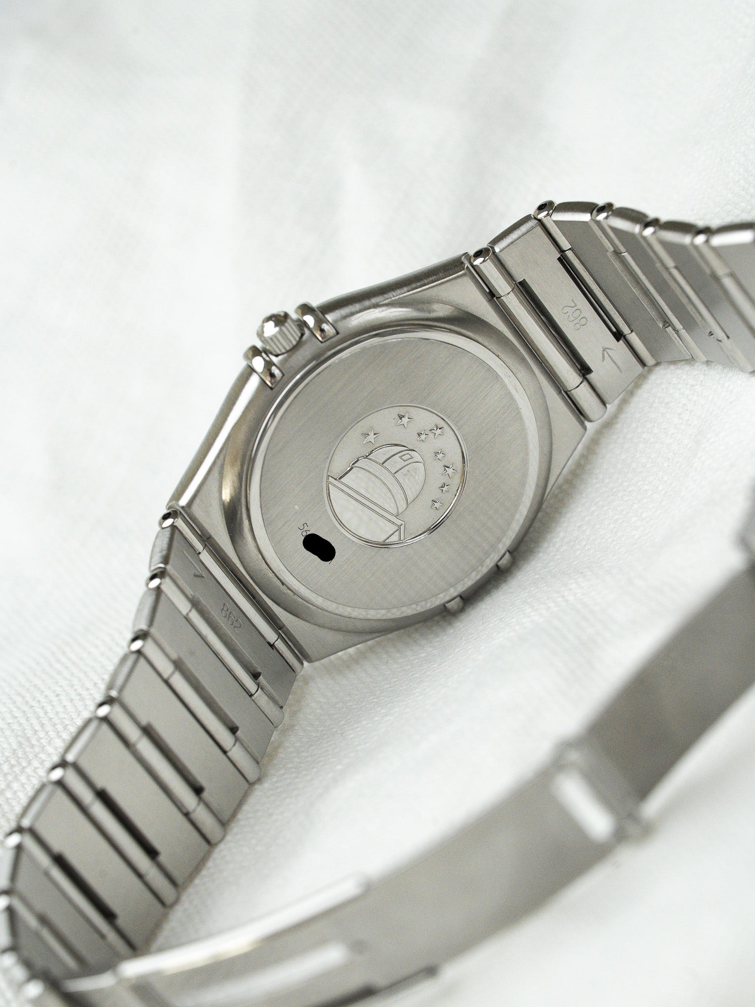 Omega Constellation vintage watch back with star emblem, stainless steel case and bracelet