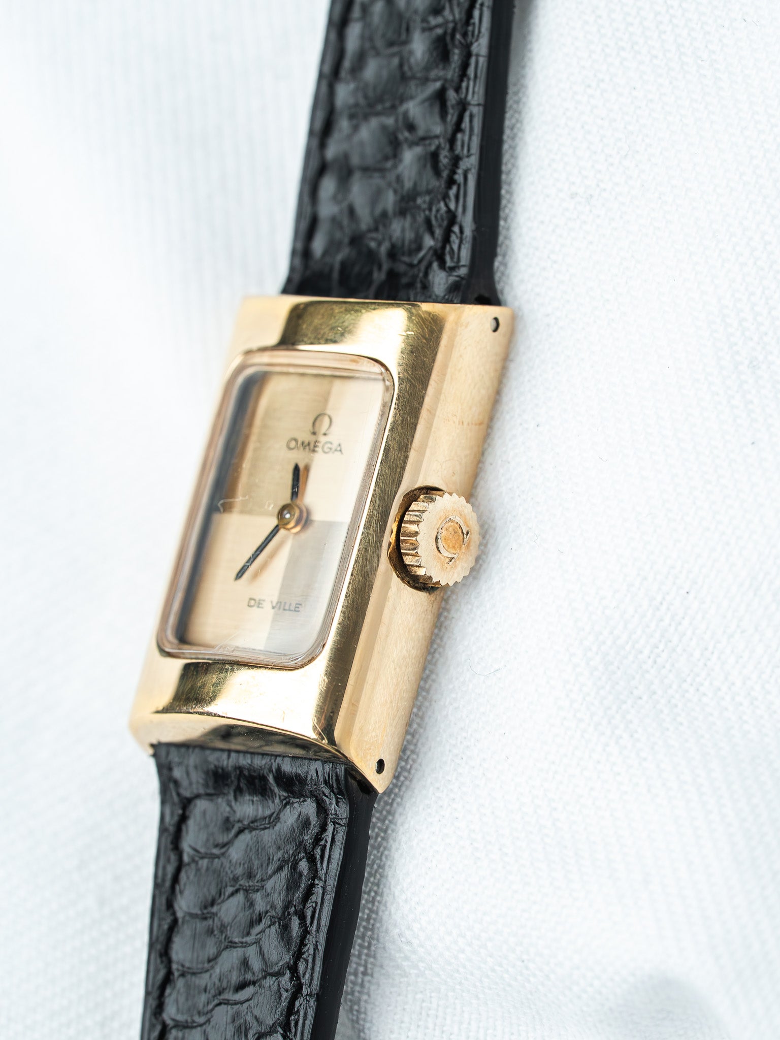 Omega De Ville vintage watch with gold case and black alligator strap