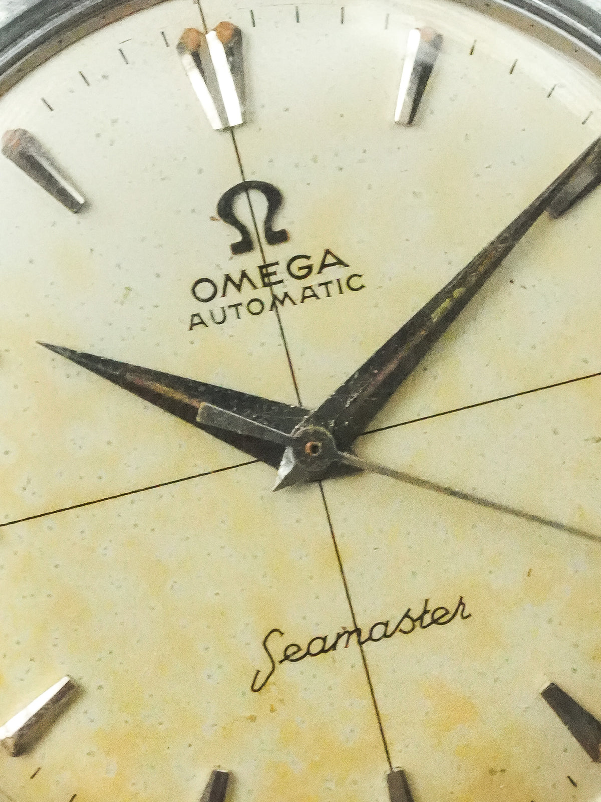 Vintage Omega Seamaster Automatic watch with aged cream dial and patinaed hands