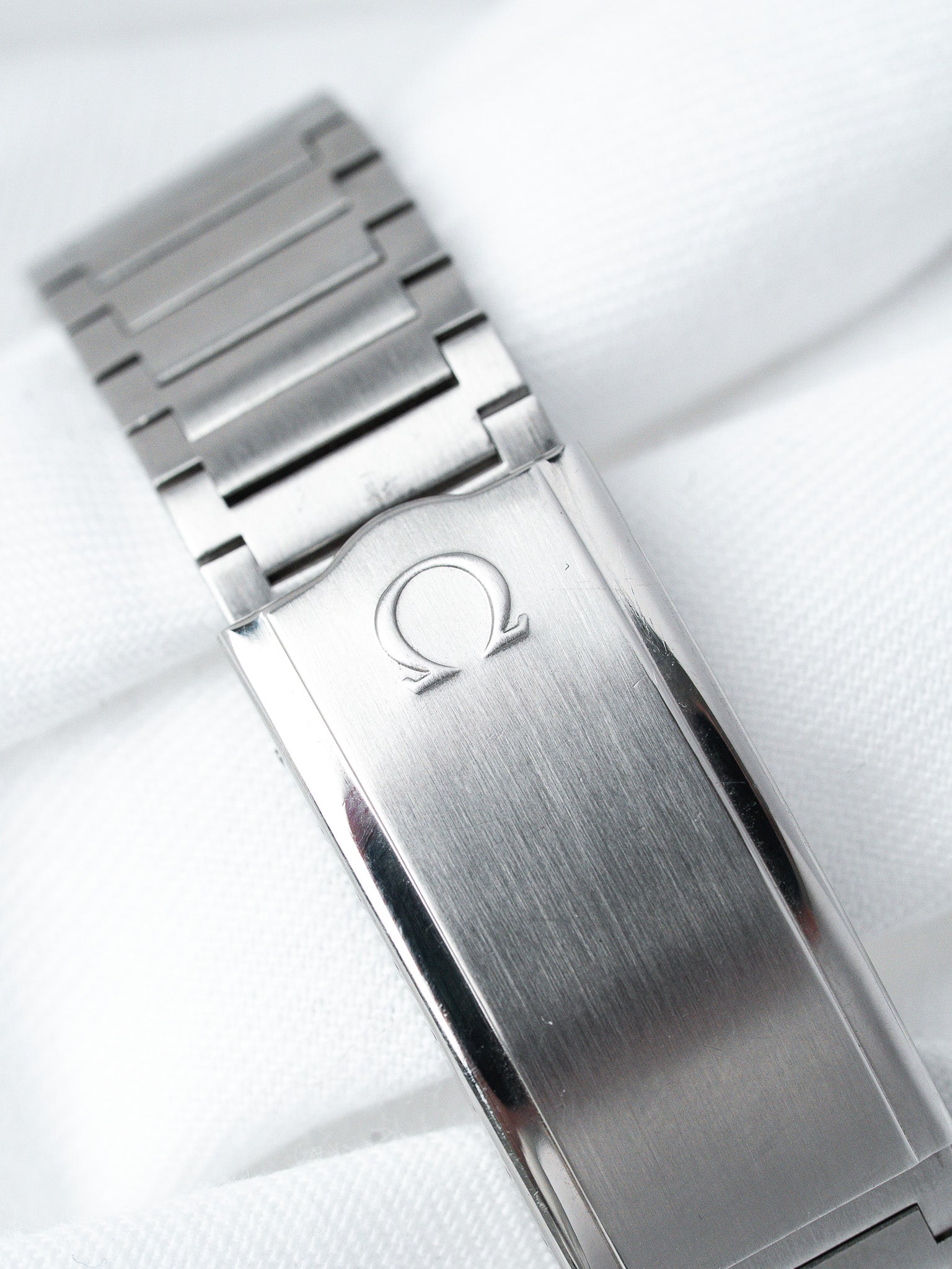 Omega vintage watch bracelet with brushed steel clasp and engraved logo