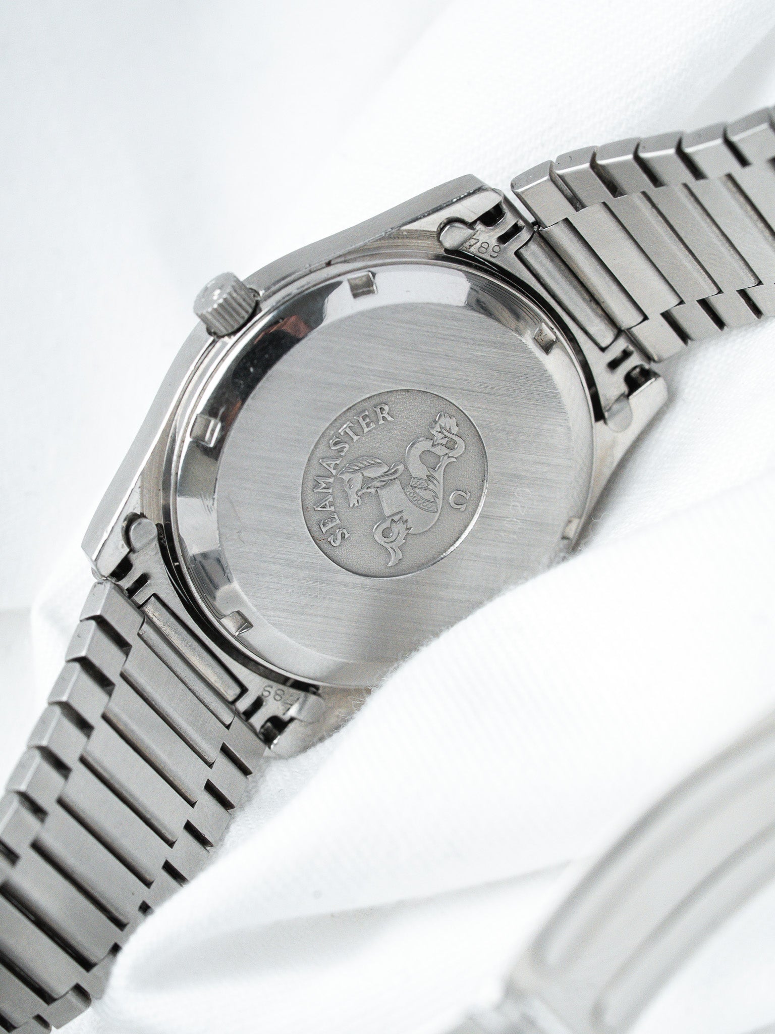 Omega Seamaster vintage stainless steel watch back with engraved logo and bracelet