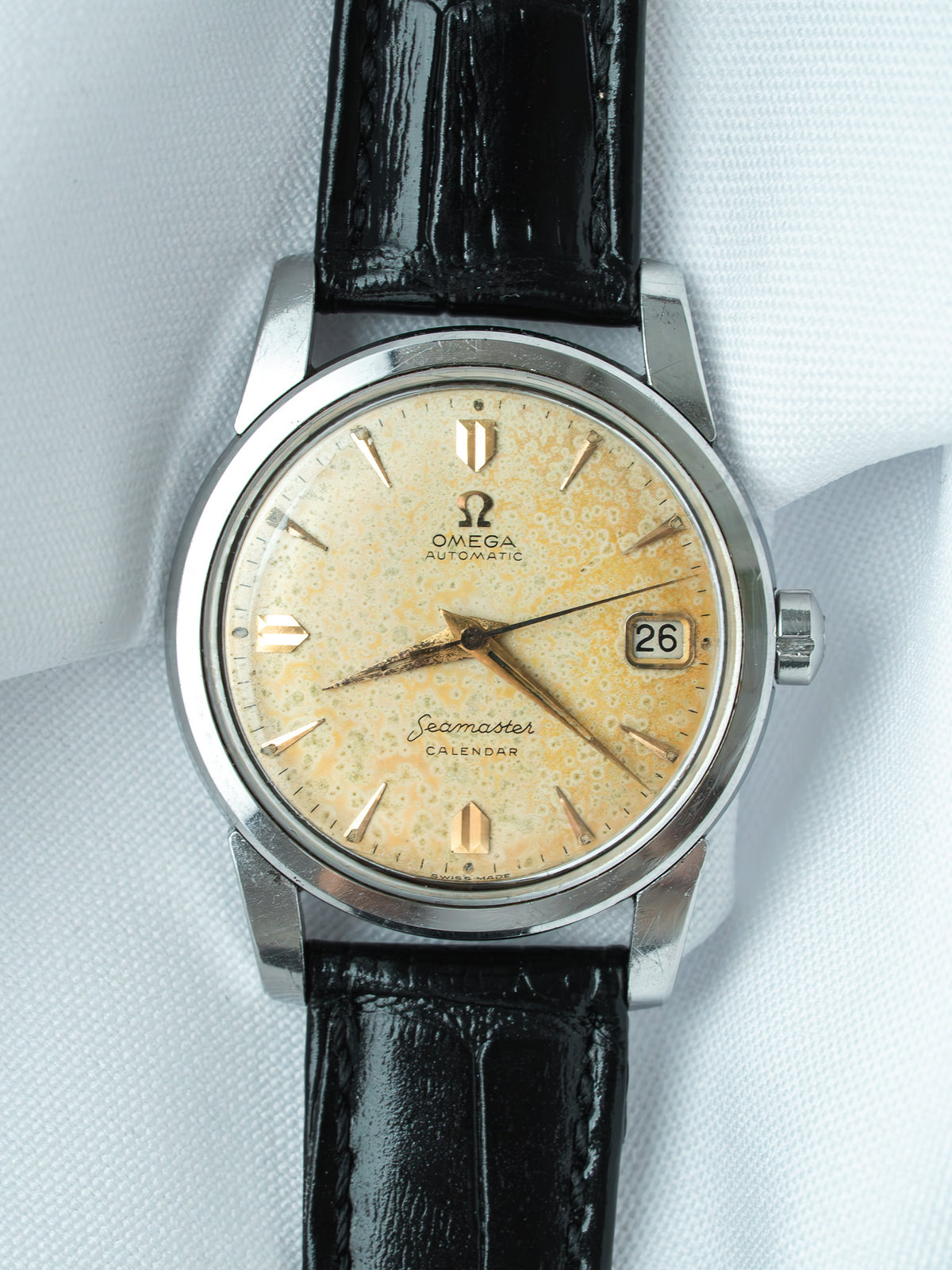 Vintage Omega Seamaster Calendar watch with cream dial, black leather strap, date window at 3