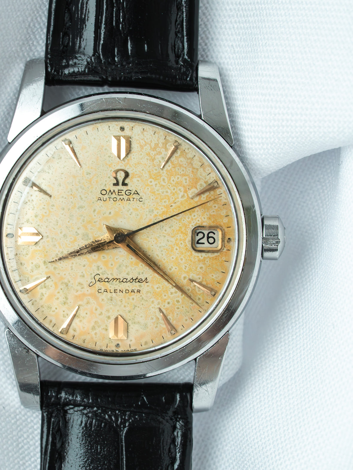 Vintage Omega Seamaster Calendar watch with cream dial, black leather strap, date window at 3