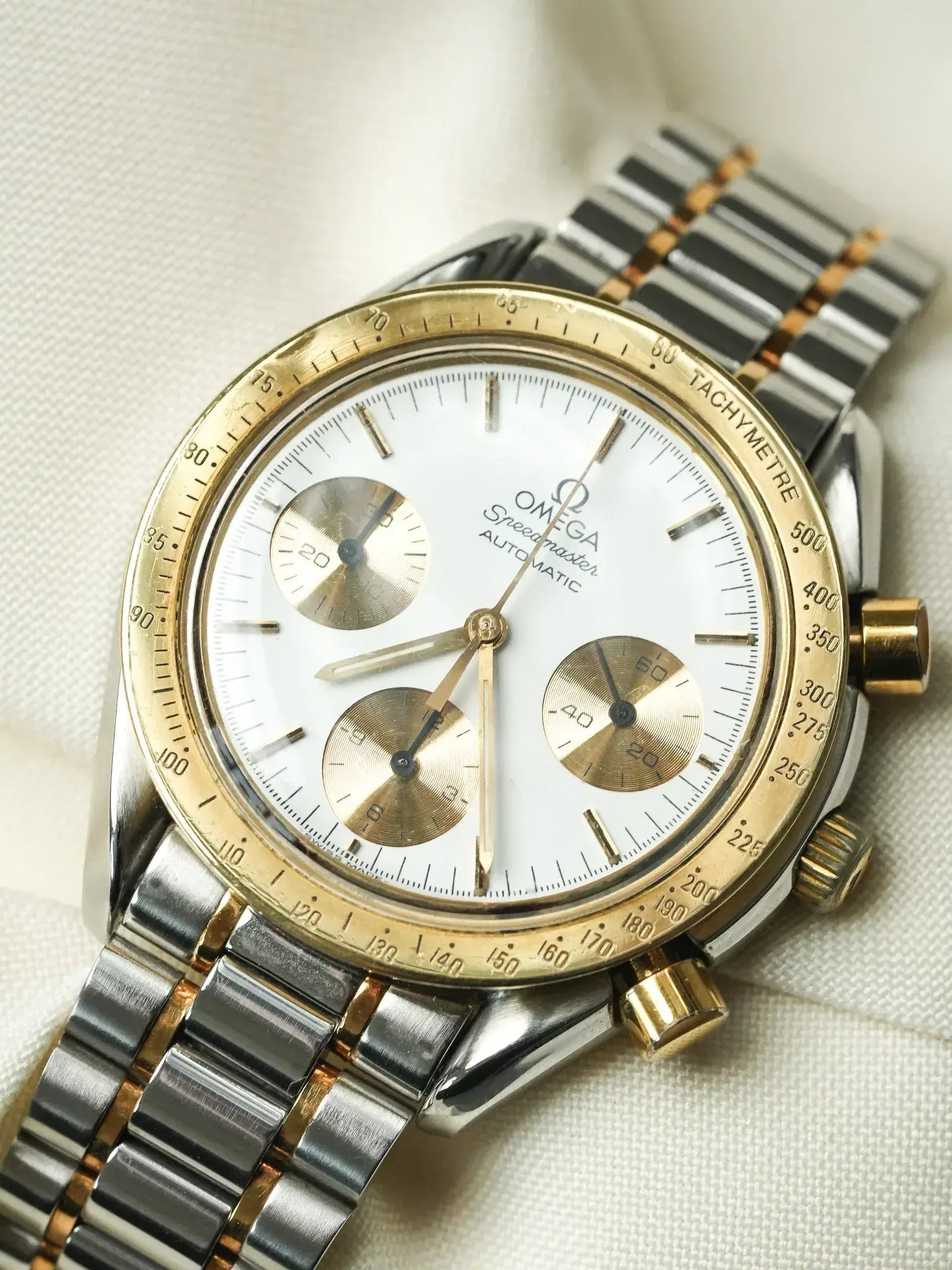 Montre Omega Speedmaster Reduced 175.0033 - Or Acier Cadran blanc (Vintage 1989) - Atelier Victor