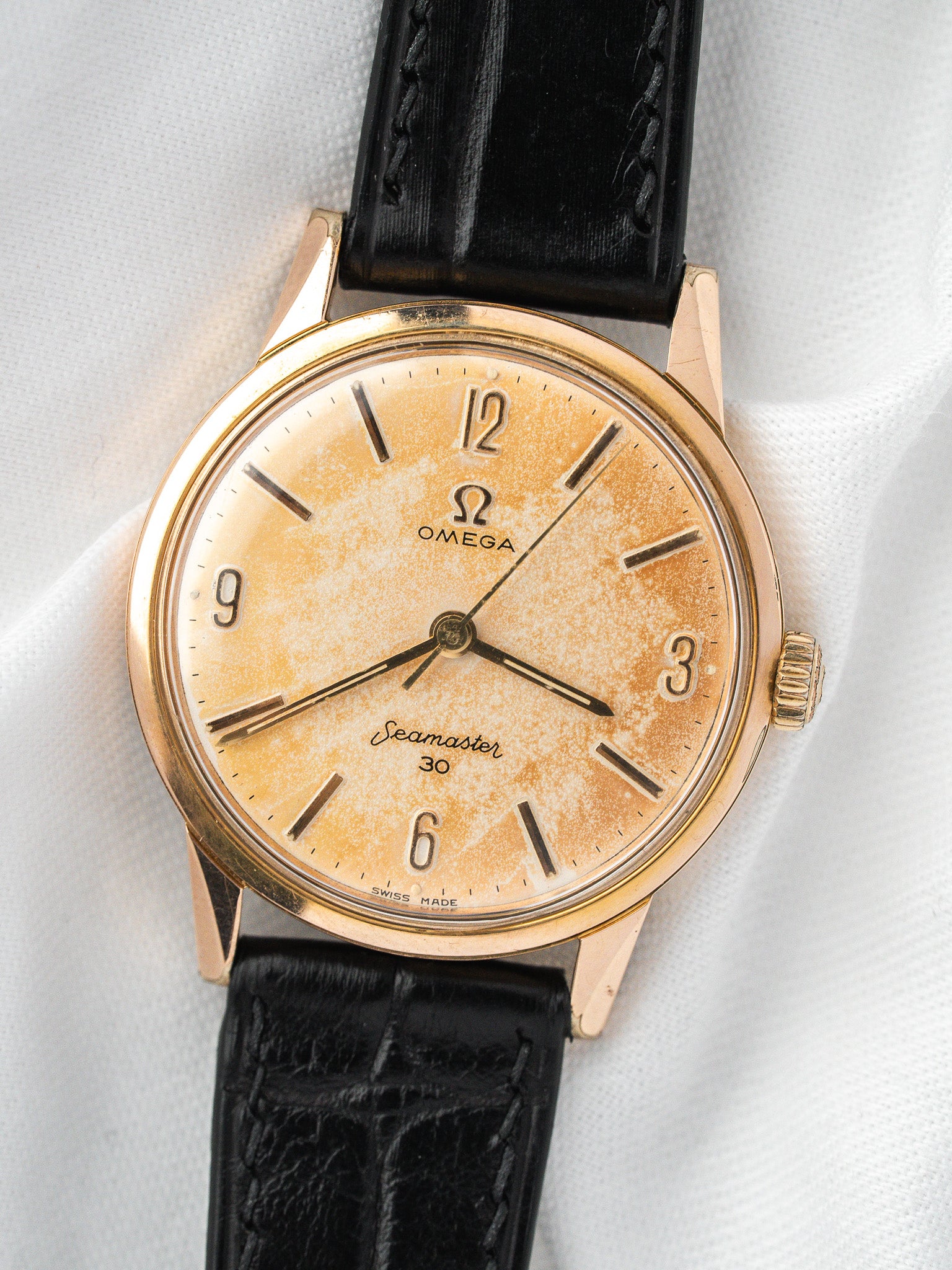 Vintage Omega Seamaster 30 watch with gold case, cream dial, black leather strap