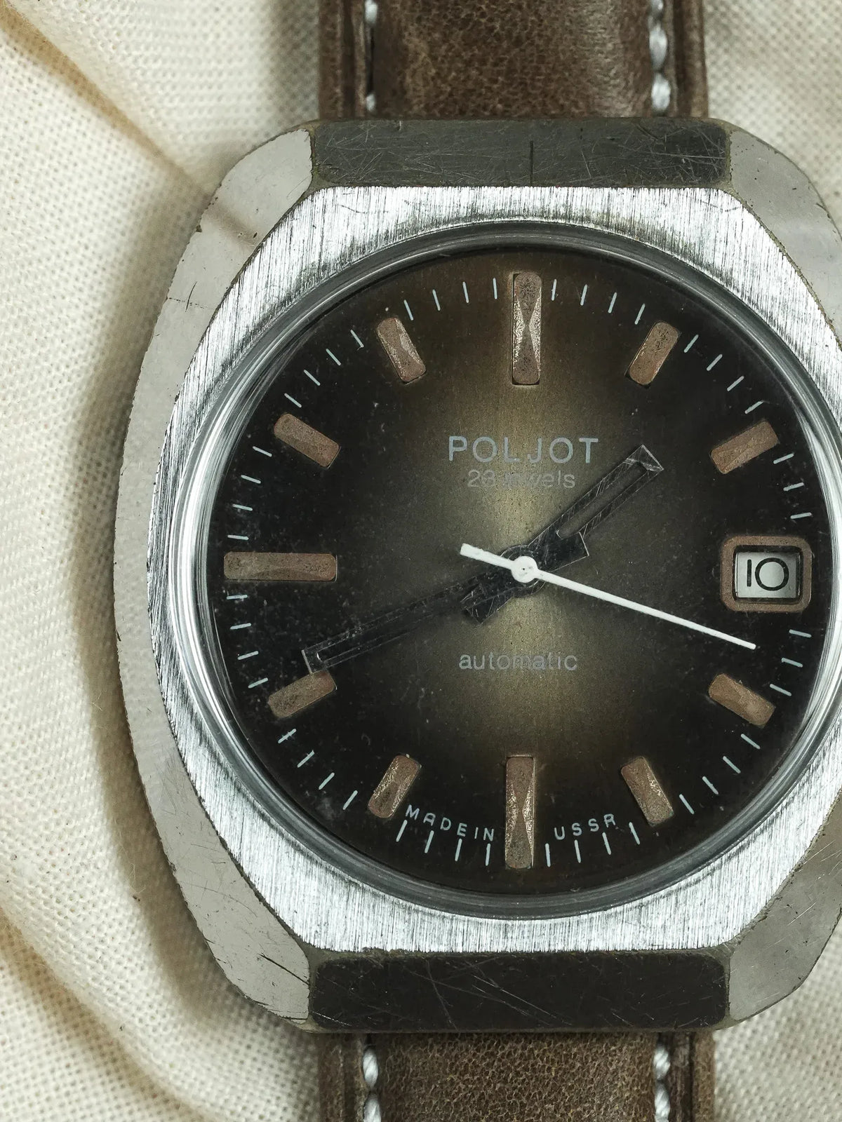 Vintage Poljot automatic watch with black dial, brown leather strap, and USSR marking