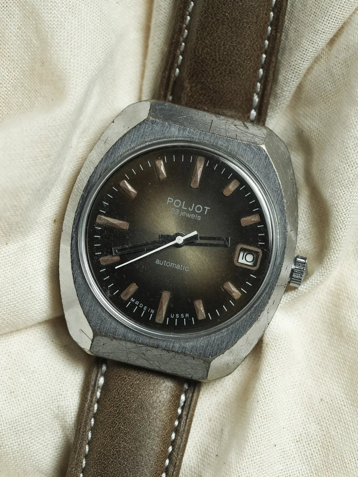 Poljot vintage automatic watch with black dial, steel case, brown leather strap