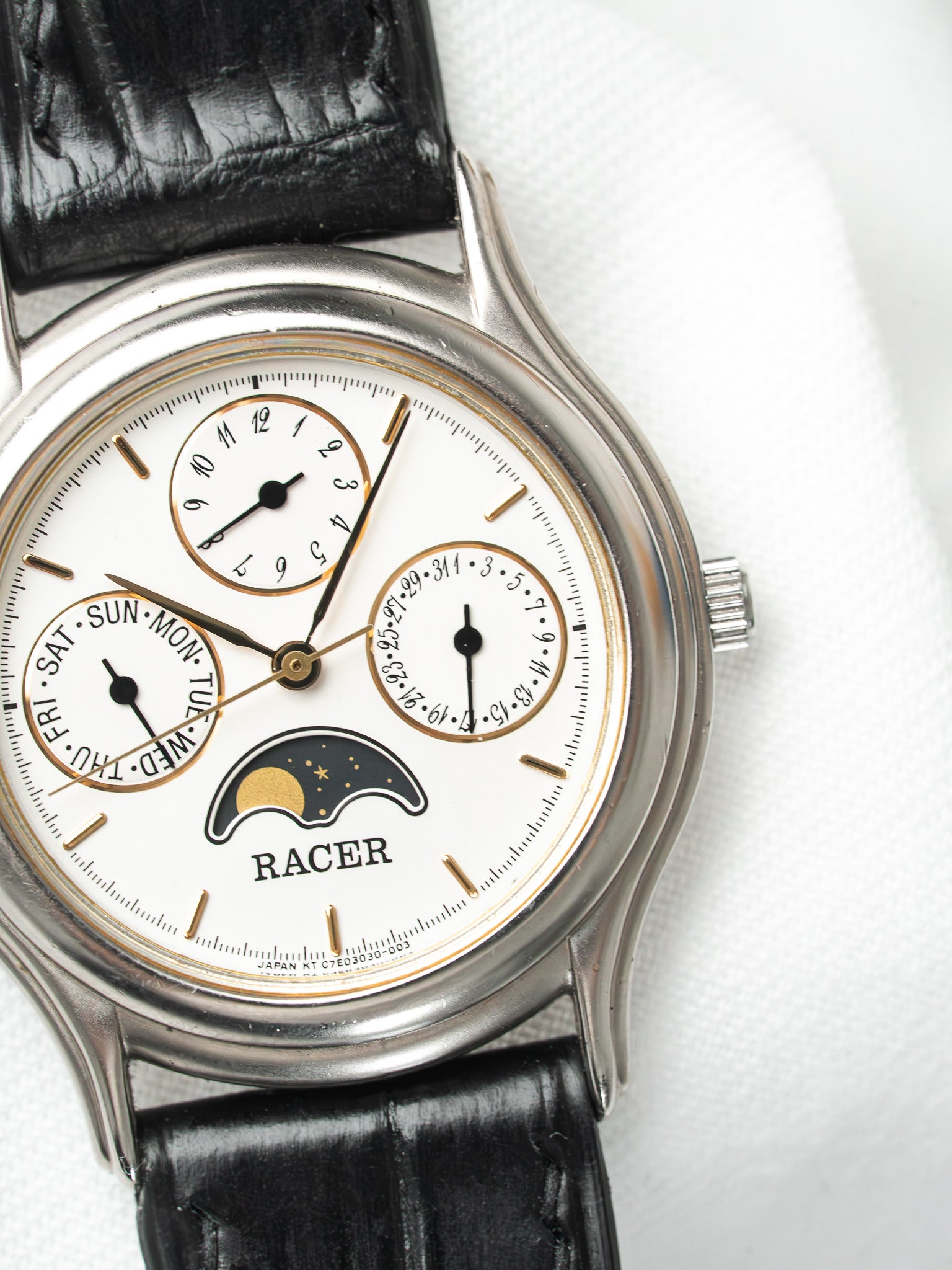 Racer vintage watch with white dial, moon phase, day date subdials, black leather strap