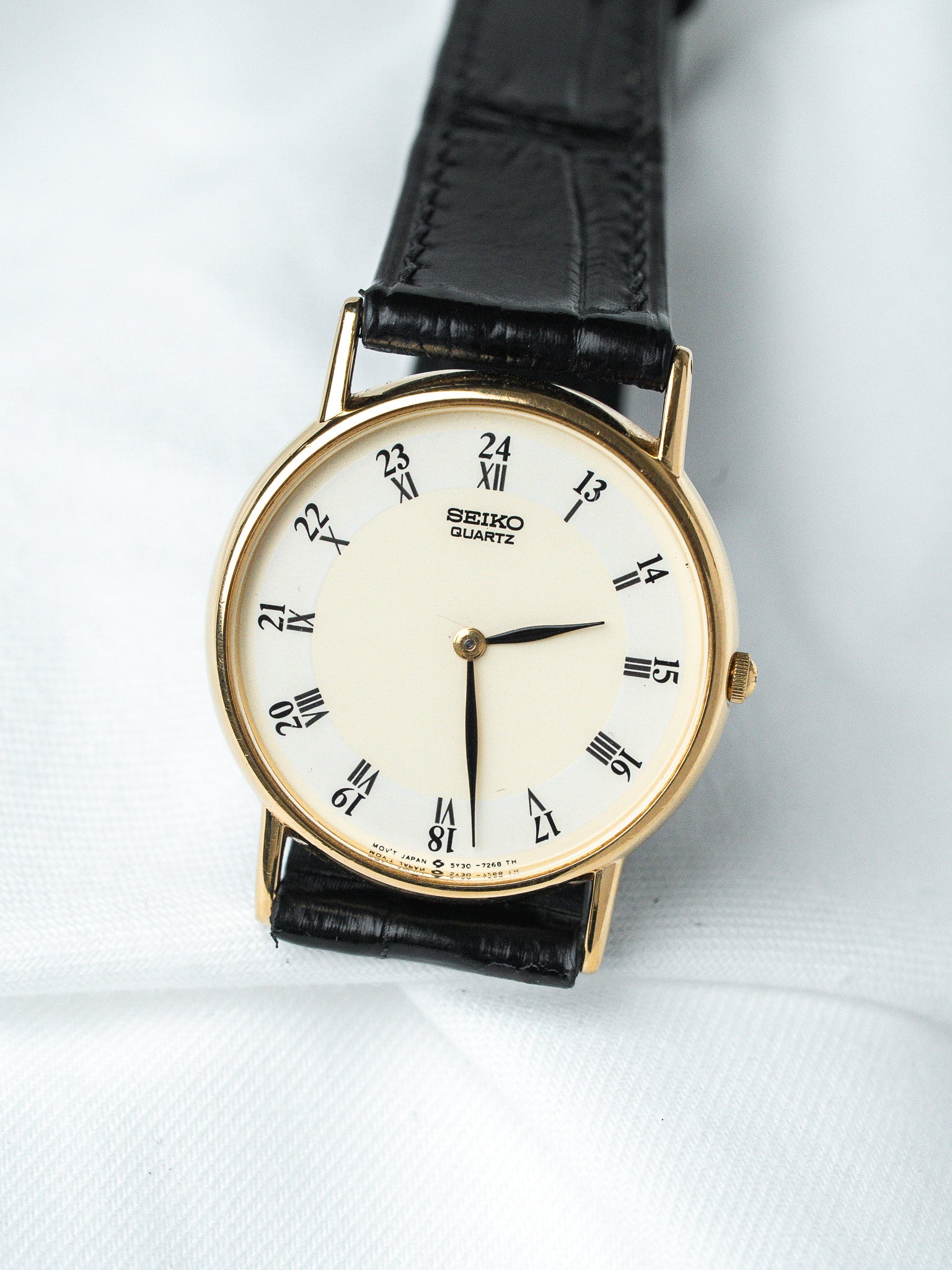 Seiko Quartz vintage watch with gold case, cream dial, black leather strap