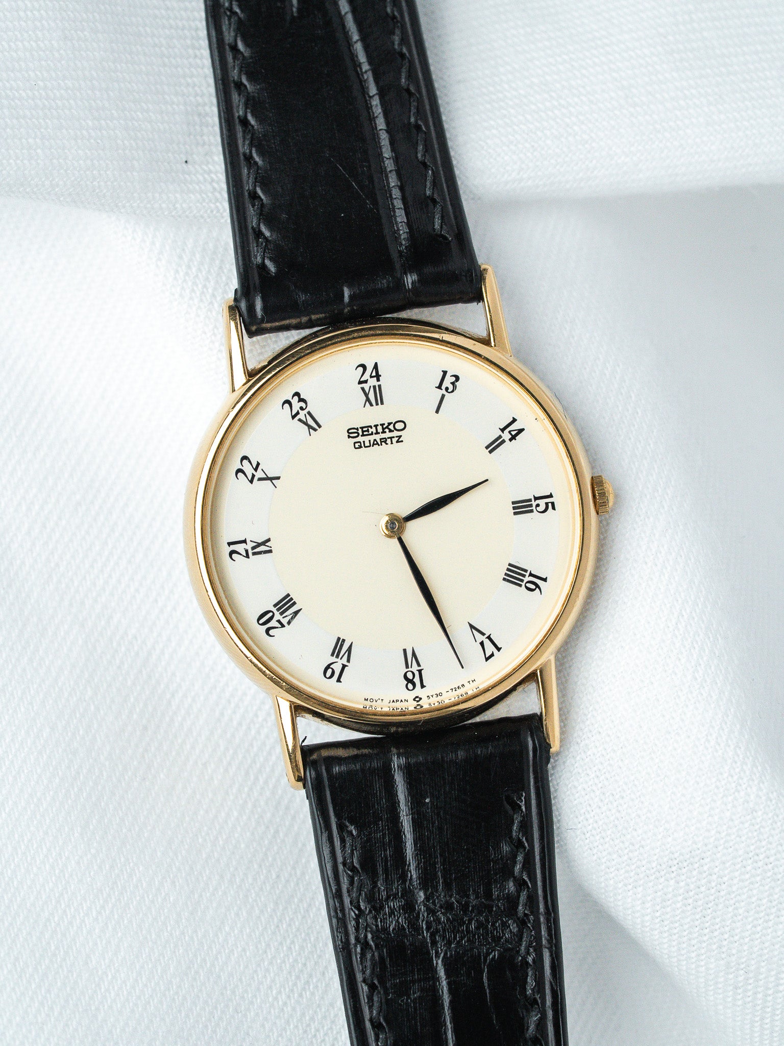 Seiko Quartz vintage watch with gold case, cream dial, black leather strap