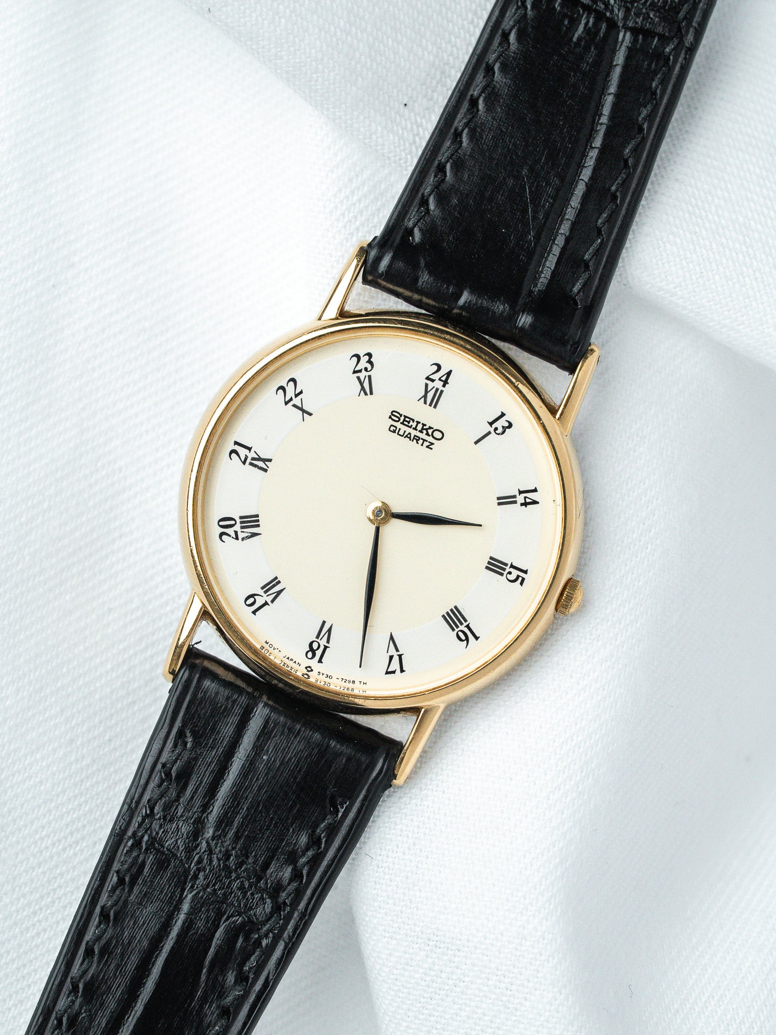 Seiko Quartz vintage watch with gold case, cream dial, black leather strap