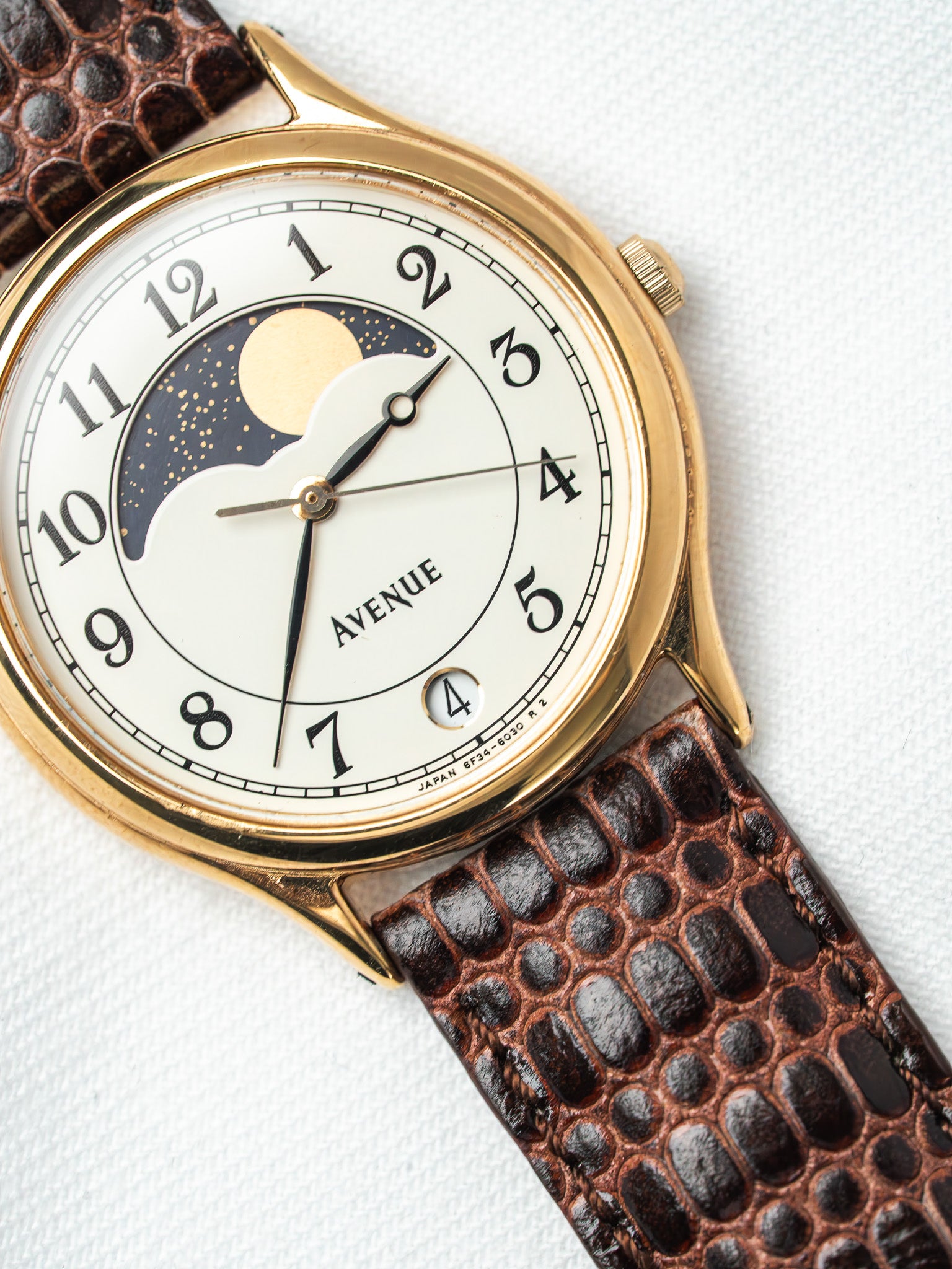 Avenue vintage watch with gold case, white dial, moon phase, brown textured strap