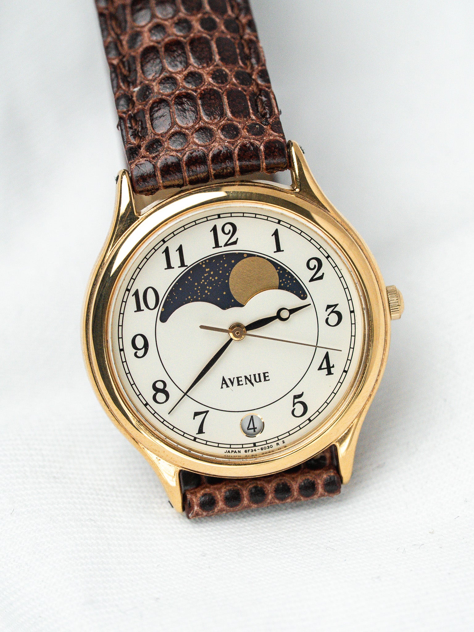 Avenue vintage watch with gold case, white dial, moon phase, brown lizard strap