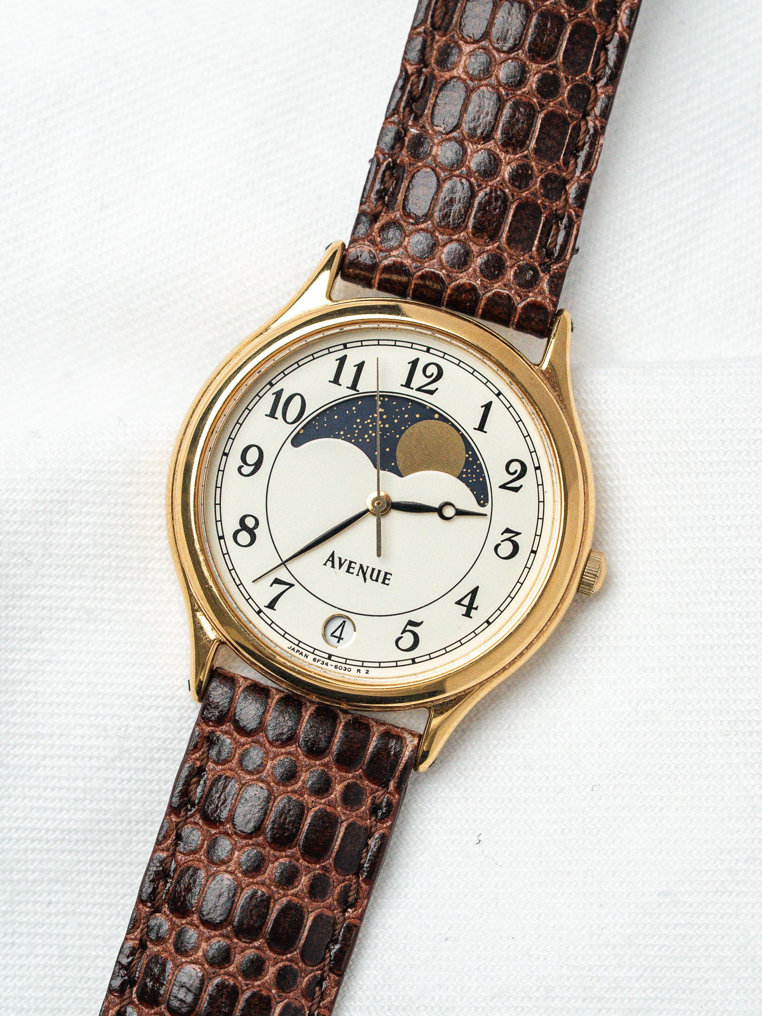 Avenue vintage watch with gold case, white dial, moon phase, brown lizard strap