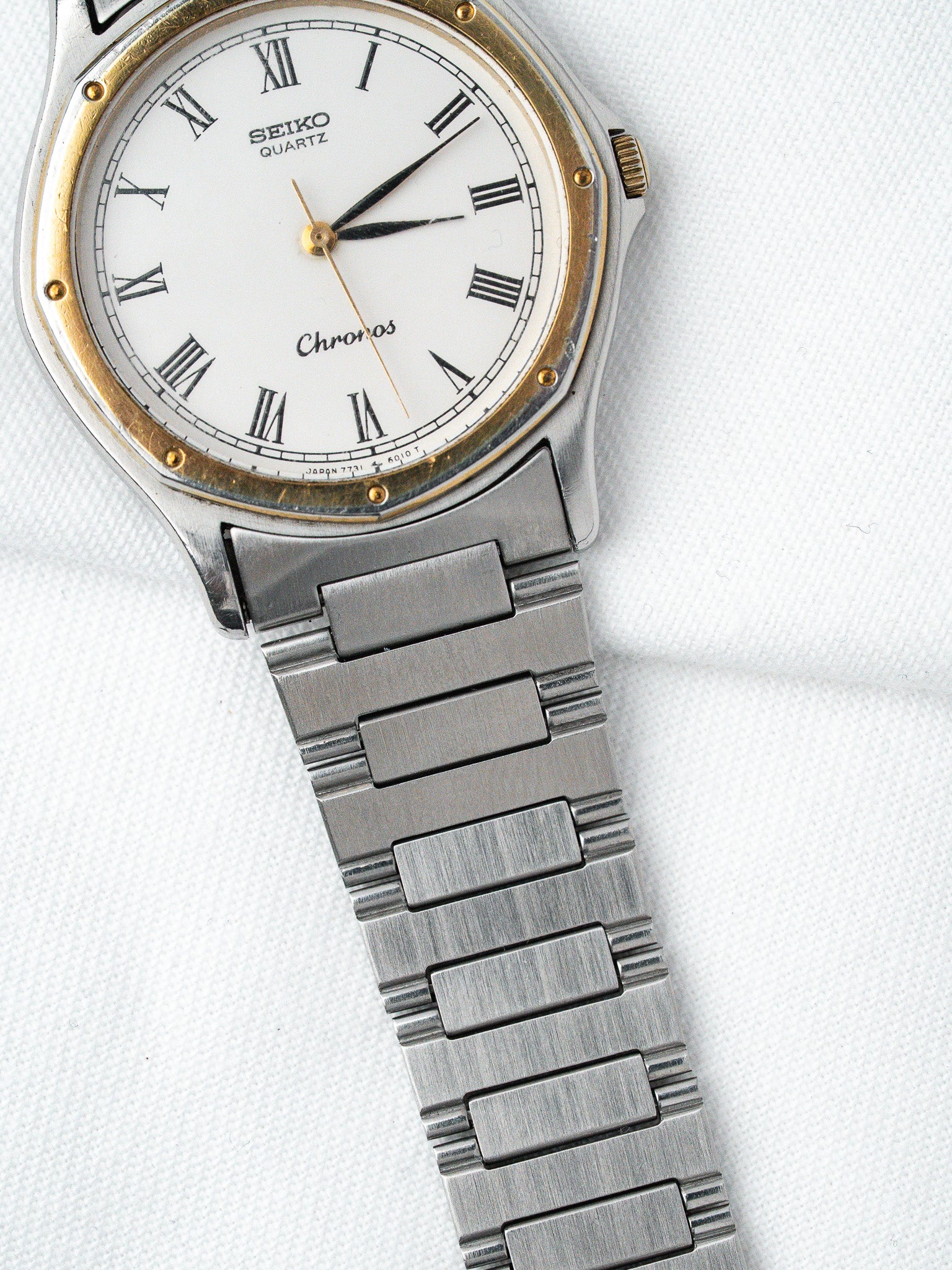 Seiko Chronos vintage quartz watch with white dial, Roman numerals, two-tone case and steel bracelet