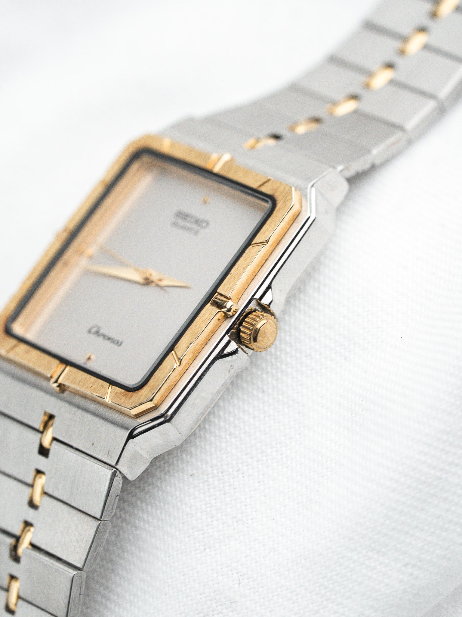 Seiko Chronos vintage watch with gold and steel case, silver dial, and bracelet
