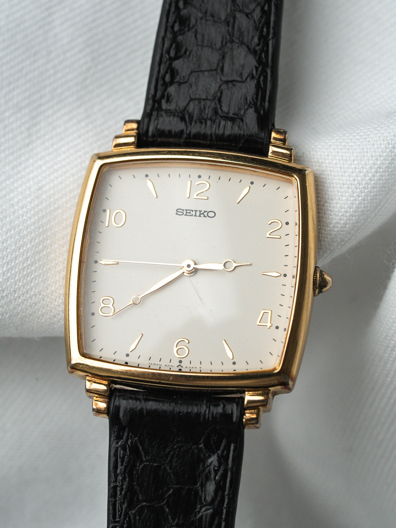 Seiko vintage watch with gold case, white dial, black alligator strap