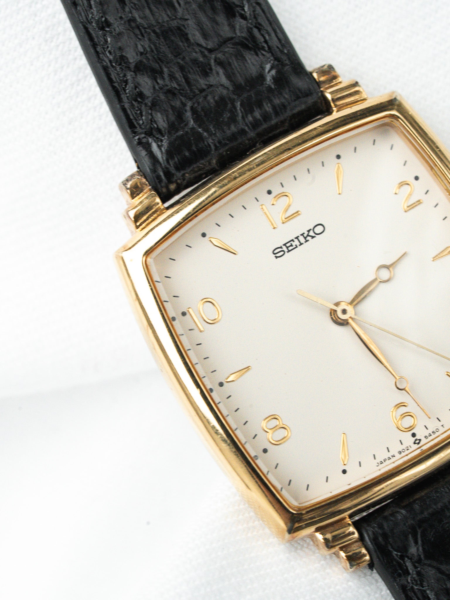Seiko vintage watch with gold case, white dial, black alligator strap