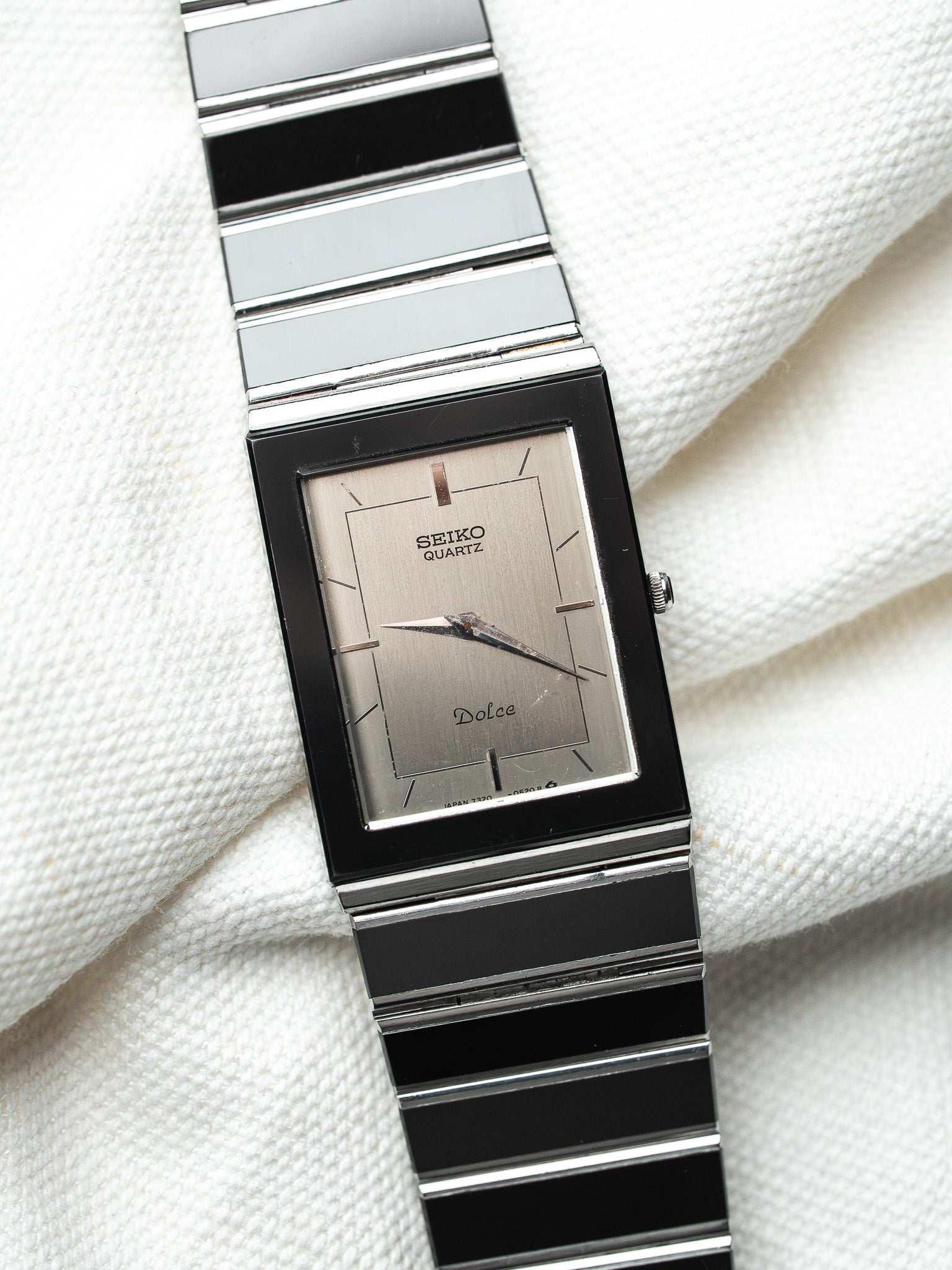 Seiko Dolce vintage quartz watch with black and silver bracelet, silver dial