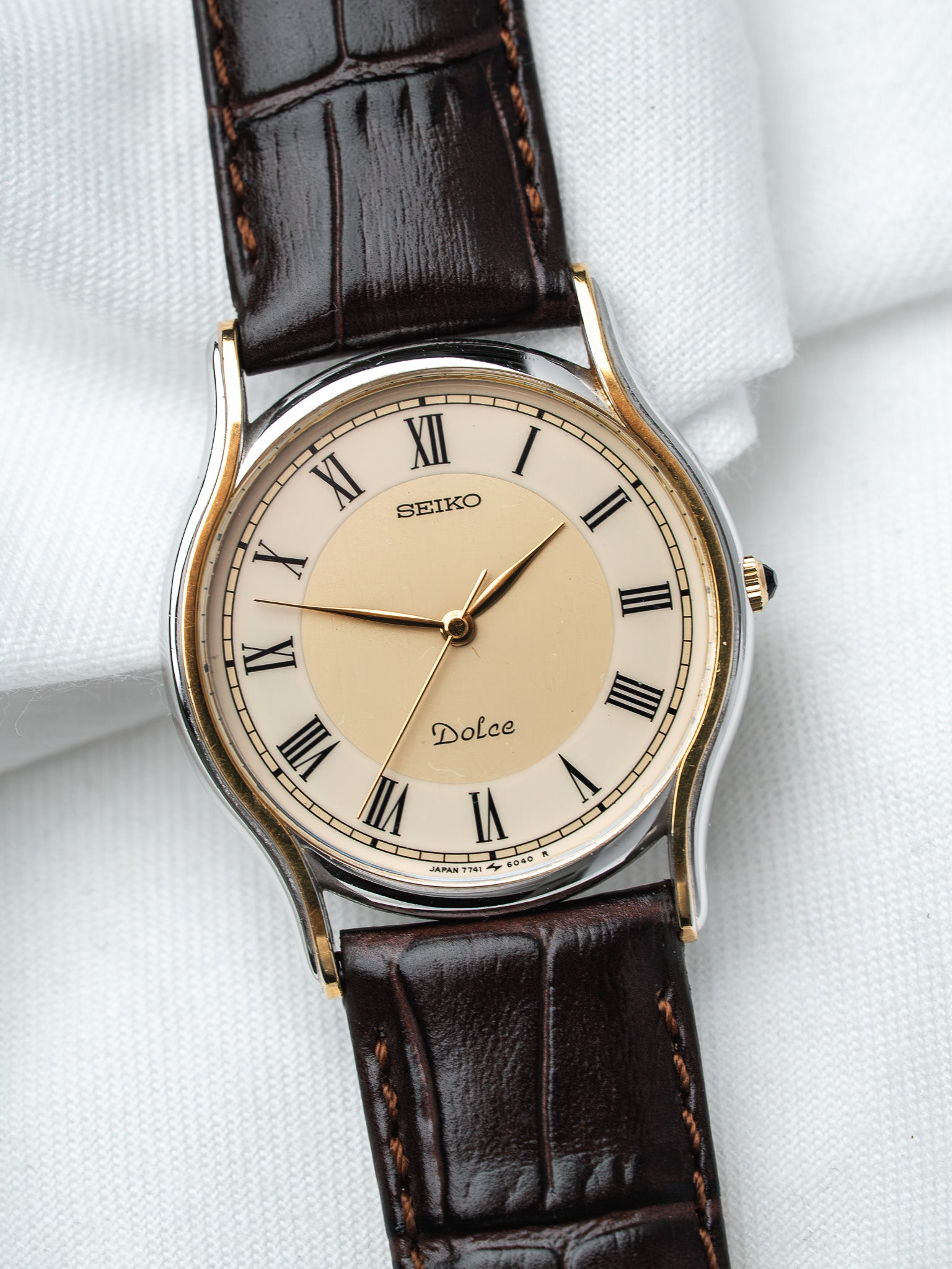 Seiko Dolce vintage watch with cream dial, Roman numerals, brown leather strap