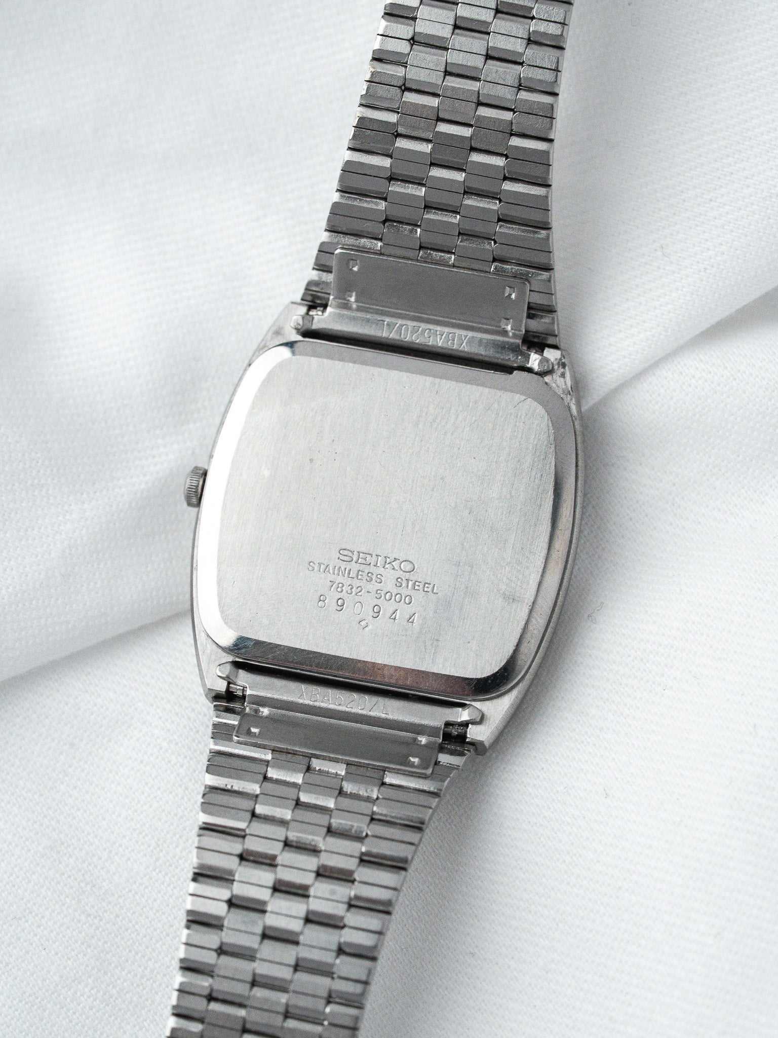 Seiko vintage stainless steel watch with square case and metal bracelet